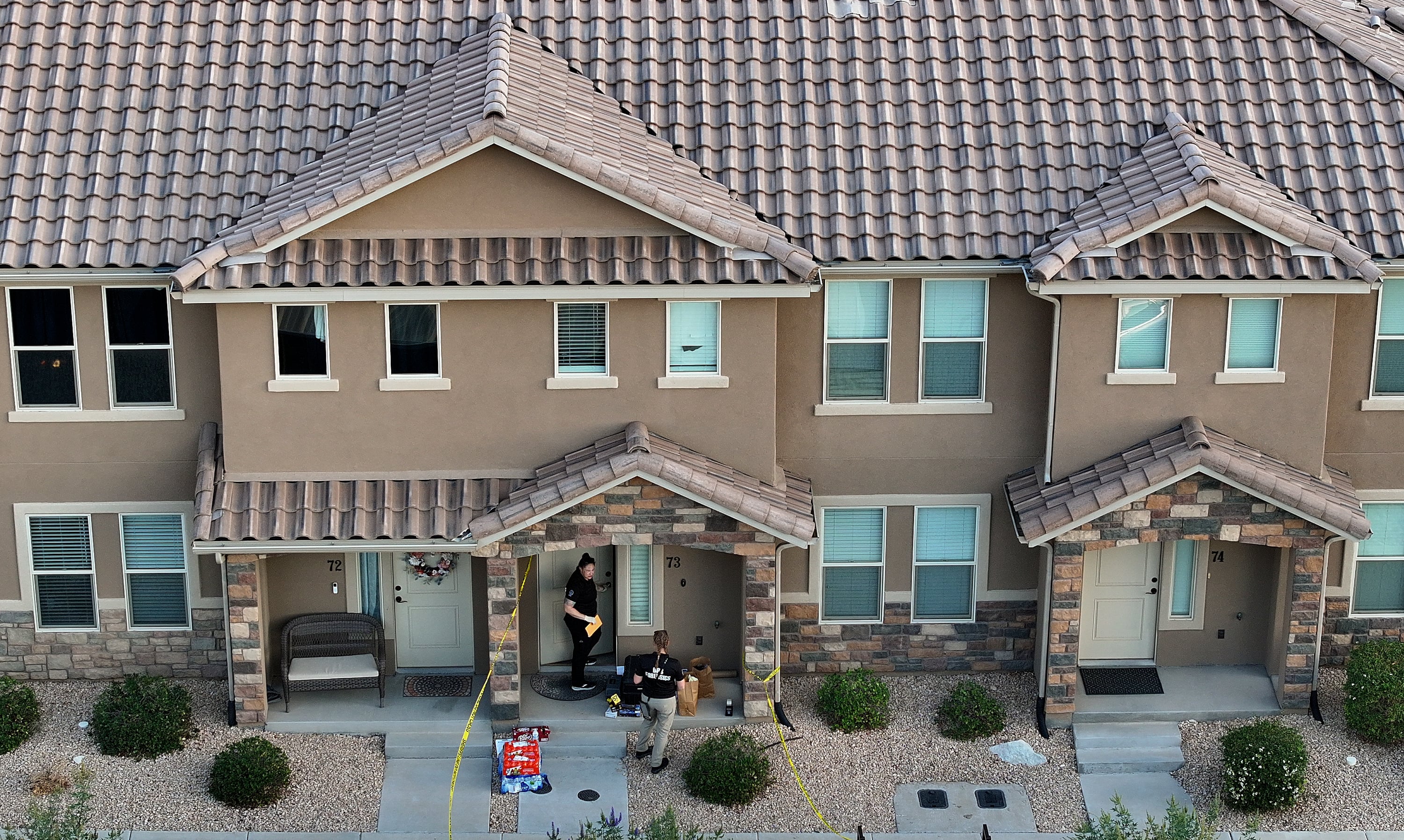 Department of Public Safety forensics workers work at the apartment of Tyler Robinson, who is the suspect in the Utah Valley University killing of Charlie Kirk, in St. George on Friday.