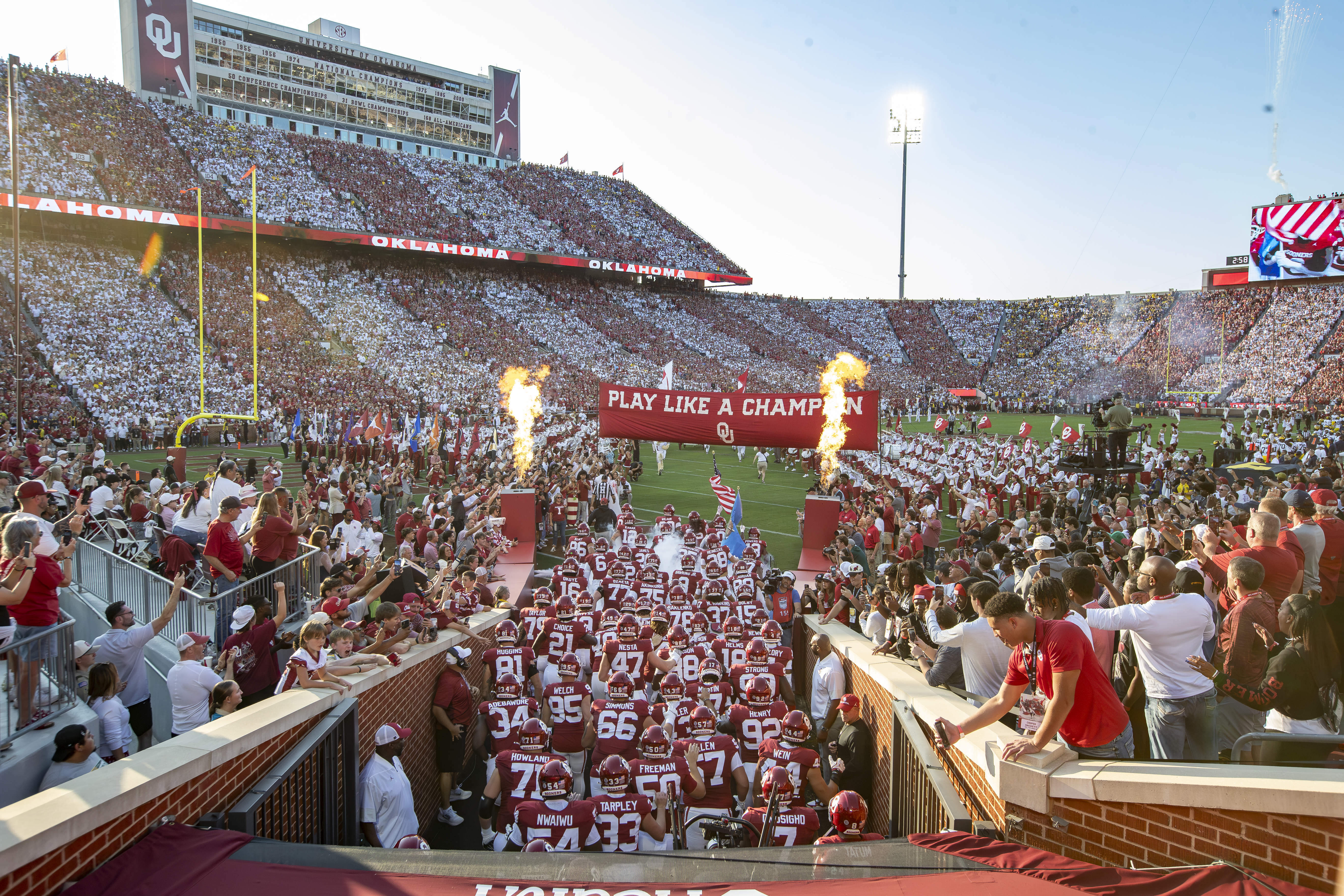 Oklahoma runs onto the field before an NCAA college football game against Michigan on Saturday, Sept. 6, 2025, in Norman, Okla. 