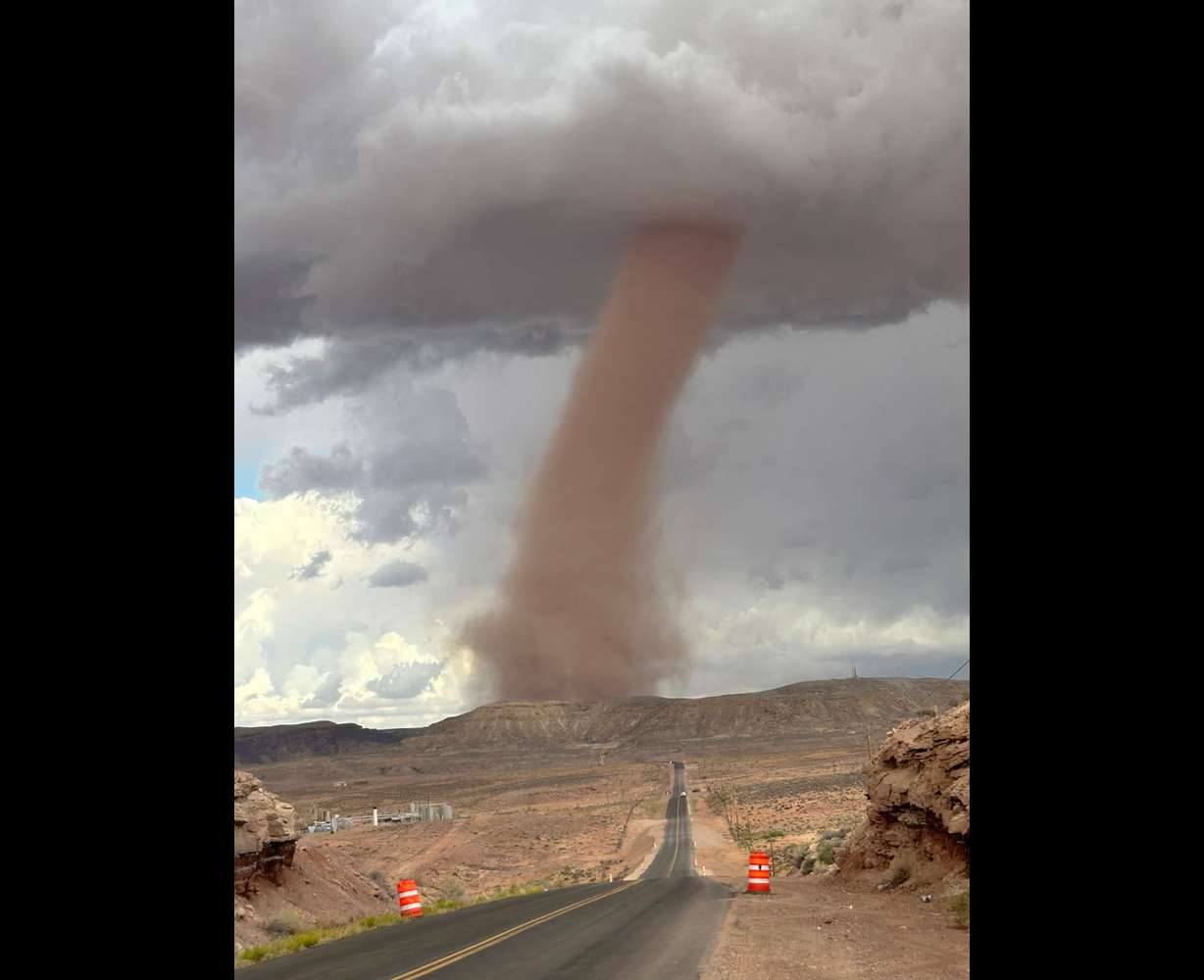 A small tornado is spotted near Montezuma Creek, San Juan County, on Saturday. Local officials say three homes are "completely damaged," and an unknown number of livestock and animals are missing due to the twister.