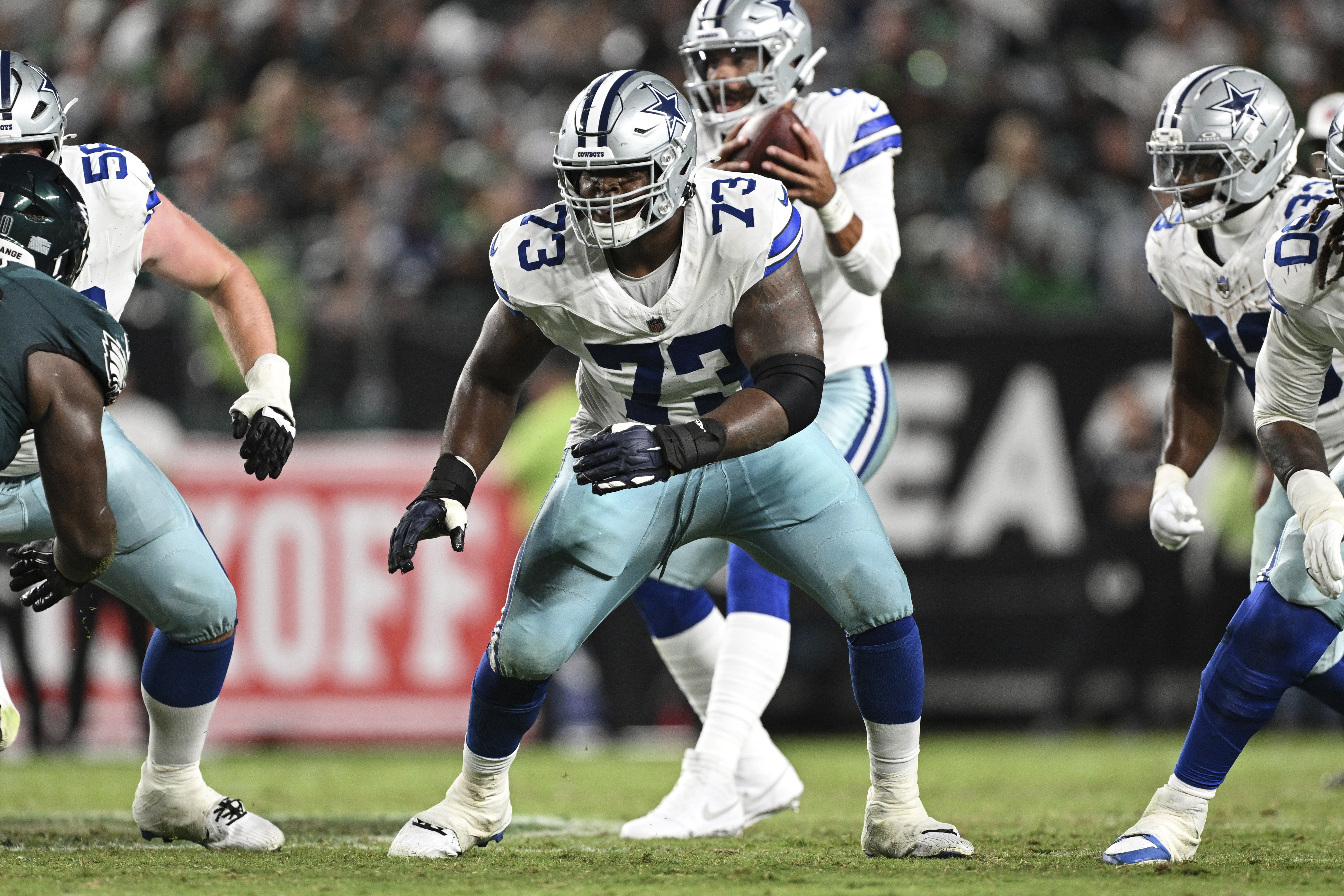 FILE - Dallas Cowboys guard Tyler Smith (73) prepares to block during the second half of an NFL football game against the Philadelphia Eagles, Thursday, Sept. 4, 2025, in Philadelphia. 