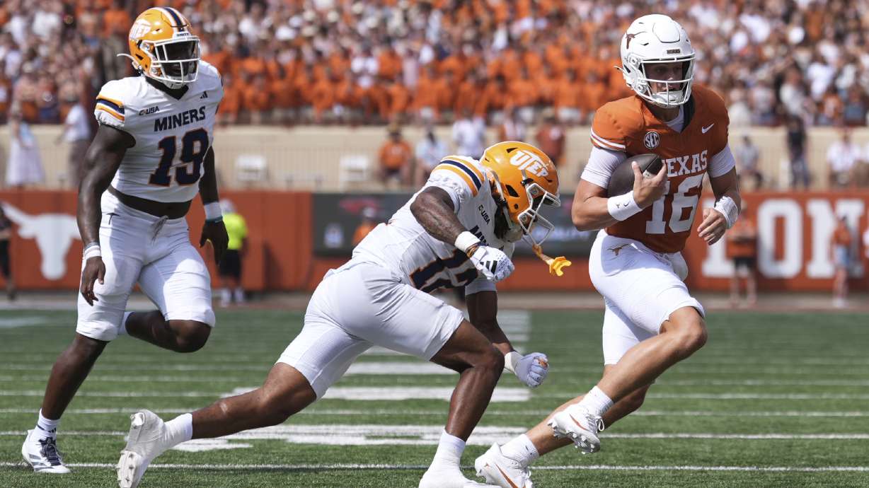Texas quarterback Arch Manning (16) runs from UTEP linebacker Donte Thompson (12) and defensive lineman Ashaad Hall (19) during the first half of an NCAA college football game in Austin, Texas, Saturday, Sept. 13, 2025.