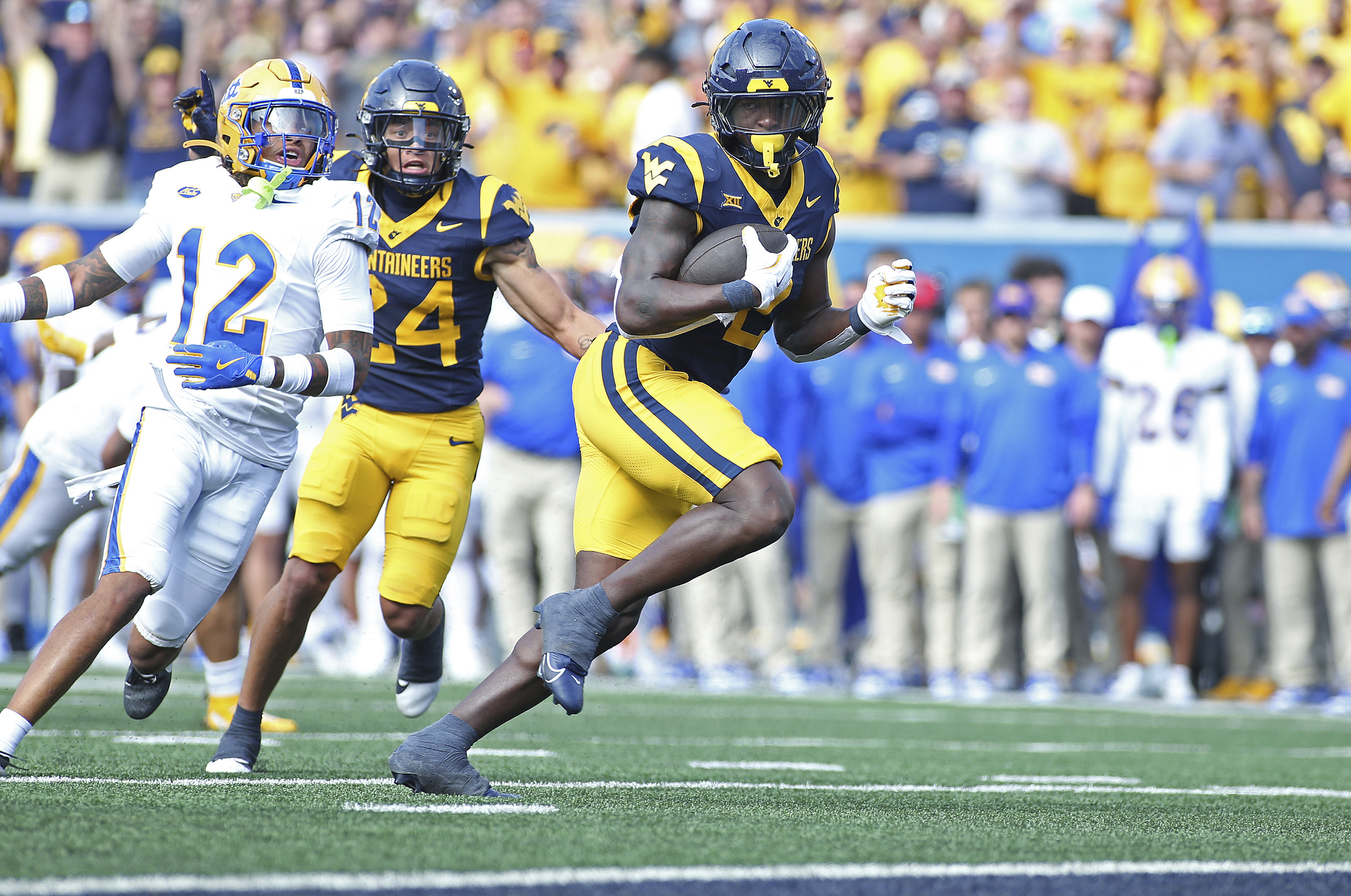 West Virginia Mountaineers running back Tye Edwards (2) runs it in for a touchdown during the first half of an NCAA college football game against Pittsburgh Saturday, Sept. 13, 2025, in Morgantown, W.Va. 