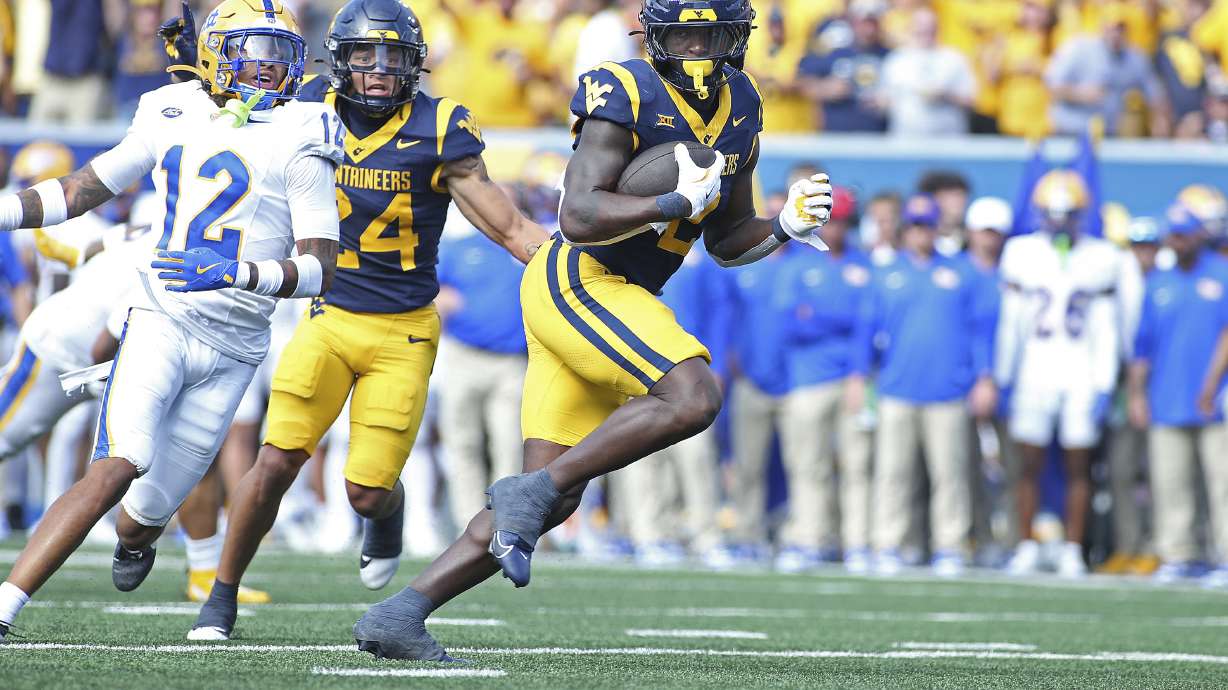 West Virginia Mountaineers running back Tye Edwards (2) runs it in for a touchdown during the first half of an NCAA college football game against Pittsburgh Saturday, Sept. 13, 2025, in Morgantown, W.Va.