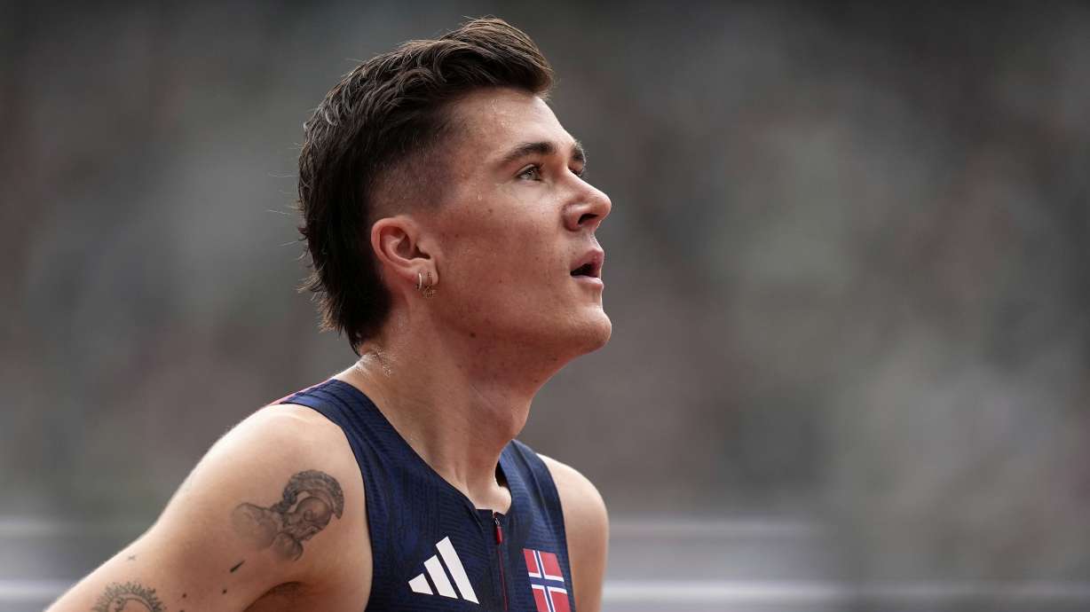Norway's Jakob Ingebrigtsen reacts after finishing a men's 1,500 meters heat at the World Athletics Championships in Tokyo, Sunday, Sept. 14, 2025.