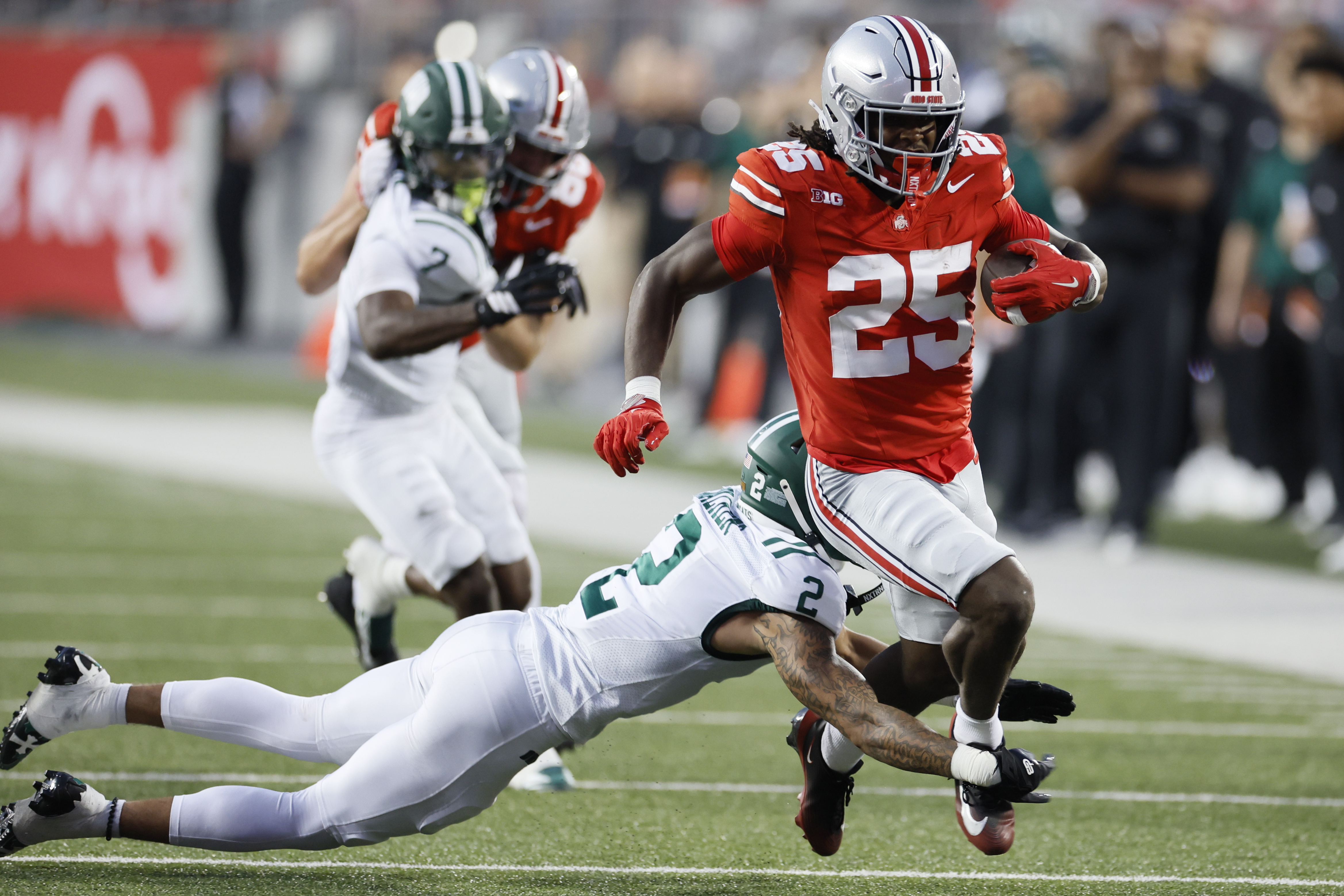 Ohio safety DJ Walker, left, tries to tackle Ohio State running back Bo Jackson during the first half of an NCAA college football game, Saturday, Sept. 13, 2025, in Columbus, Ohio. 