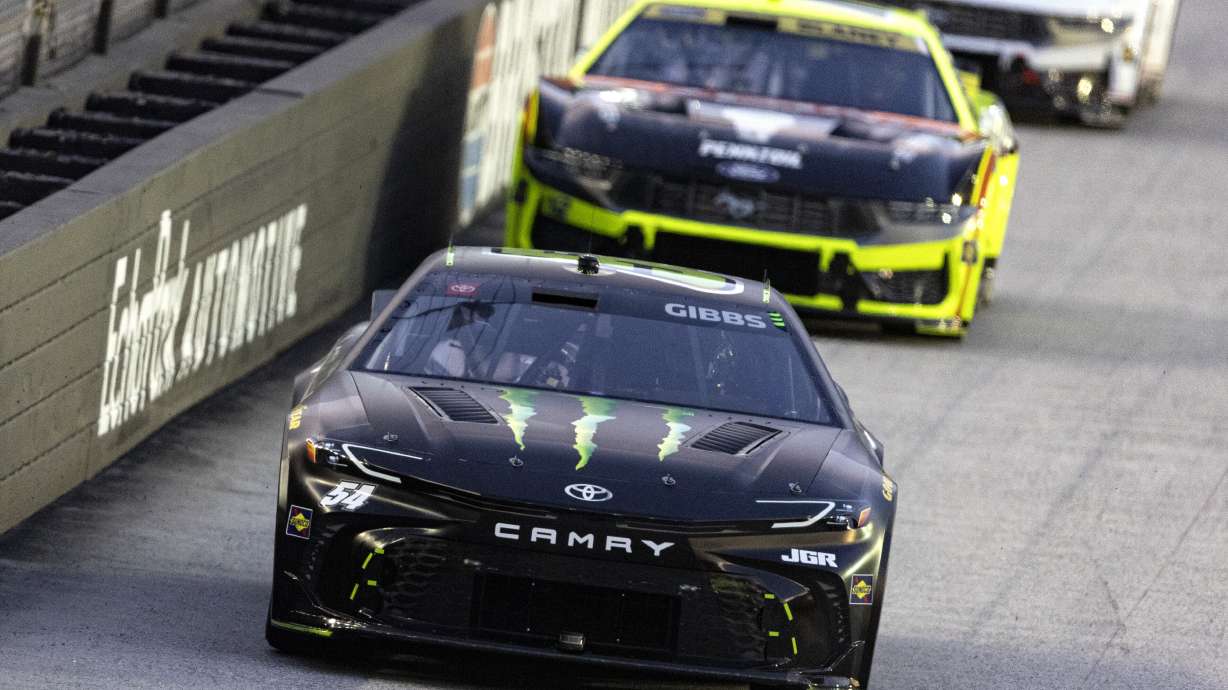 Ty Gibbs (54) leads Ryan Blaney (12) during a NASCAR Cup Series auto race, Saturday, Sept. 13, 2025, in Bristol, Tenn.