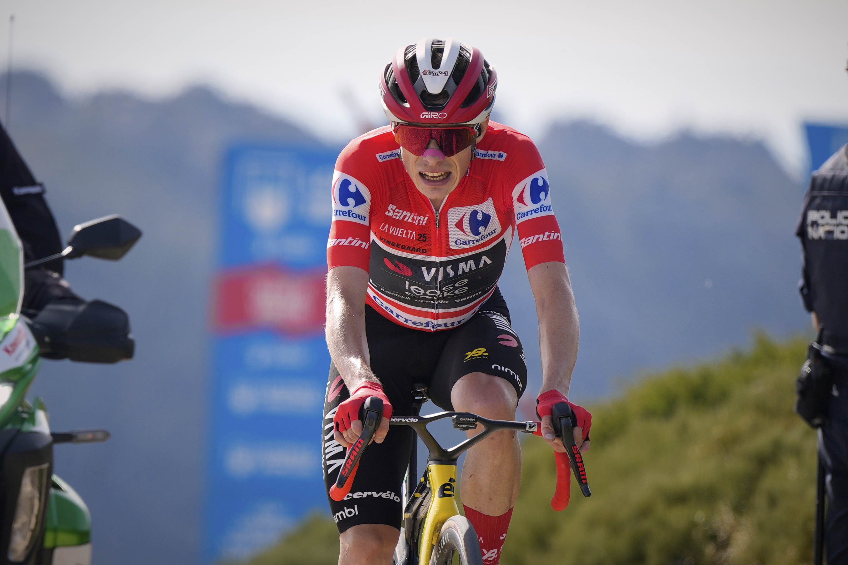 Danish cyclist Jonas Vingegaard completes the final meters before winning the 20th stage and his first overall victory in the Spanish cycling race La Vuelta, from Robledo de Chavela to Bola del Mundo, in Puerto de Navacerrada, Spain, on Saturday, September 13, 2025. 
