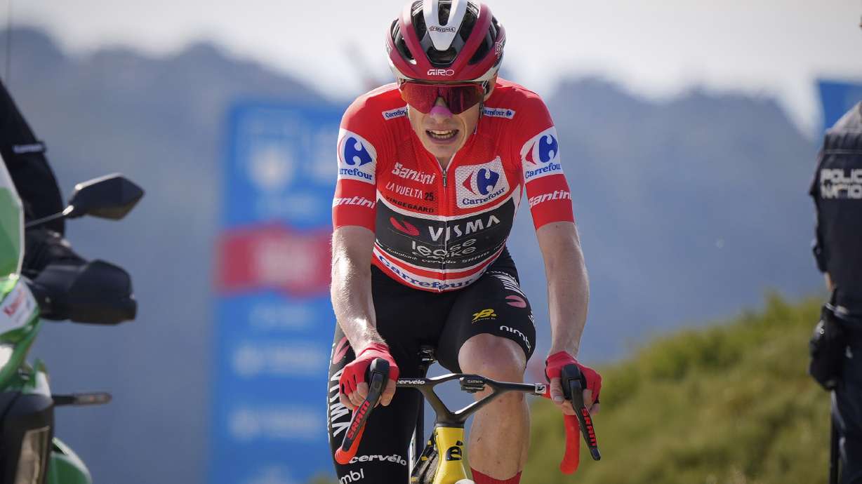 Danish cyclist Jonas Vingegaard completes the final meters before winning the 20th stage and his first overall victory in the Spanish cycling race La Vuelta, from Robledo de Chavela to Bola del Mundo, in Puerto de Navacerrada, Spain, on Saturday, September 13, 2025.