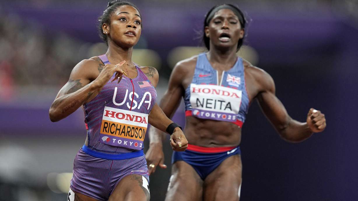 United States' Sha'Carri Richardson and Britain's Daryll Neita finish a women's 100 meters semifinal at the World Athletics Championships in Tokyo, Sunday, Sept. 14, 2025.
