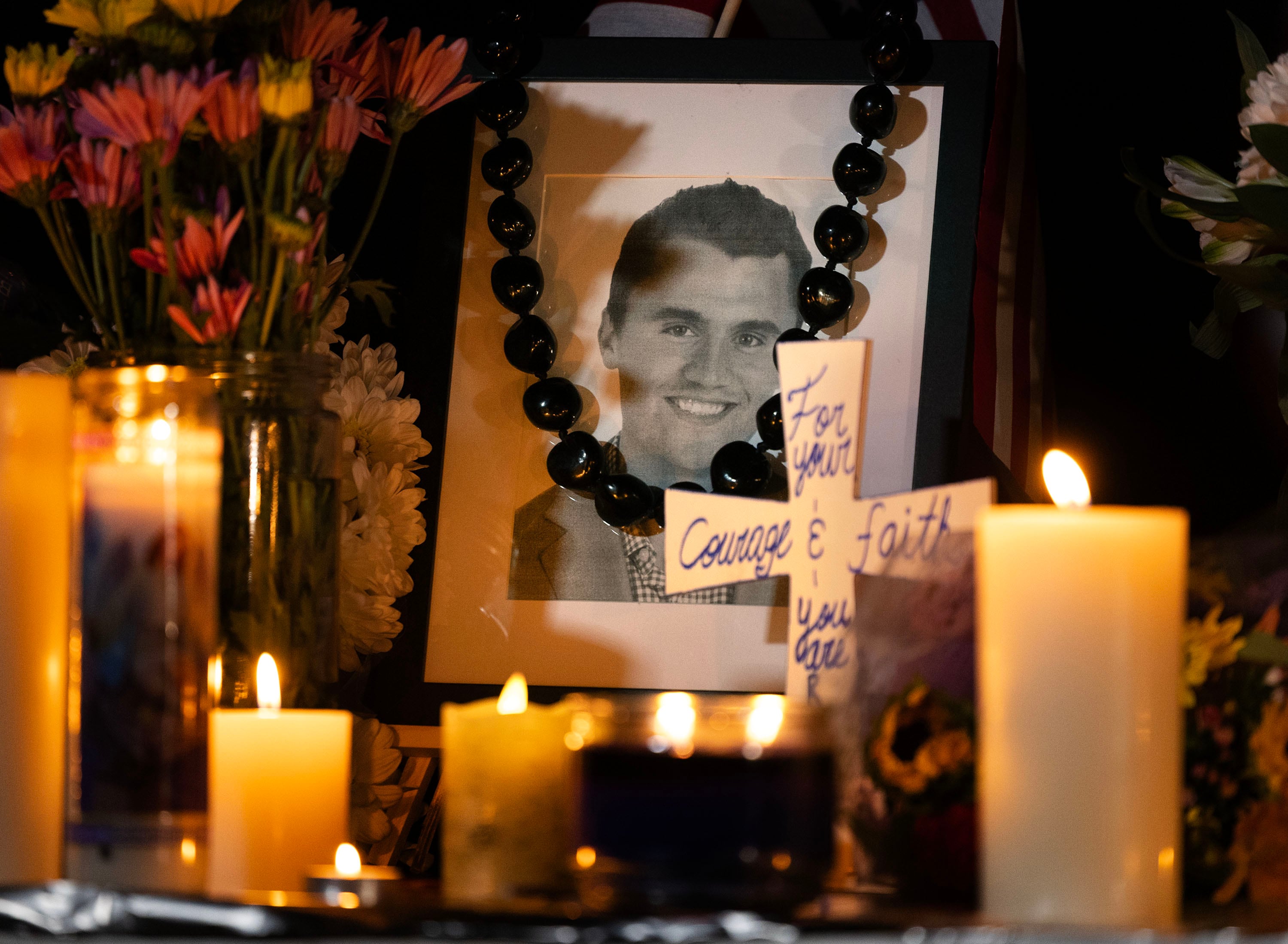 A photograph of Charlie Kirk is displayed at a vigil at Memorial Park in Provo on Friday.