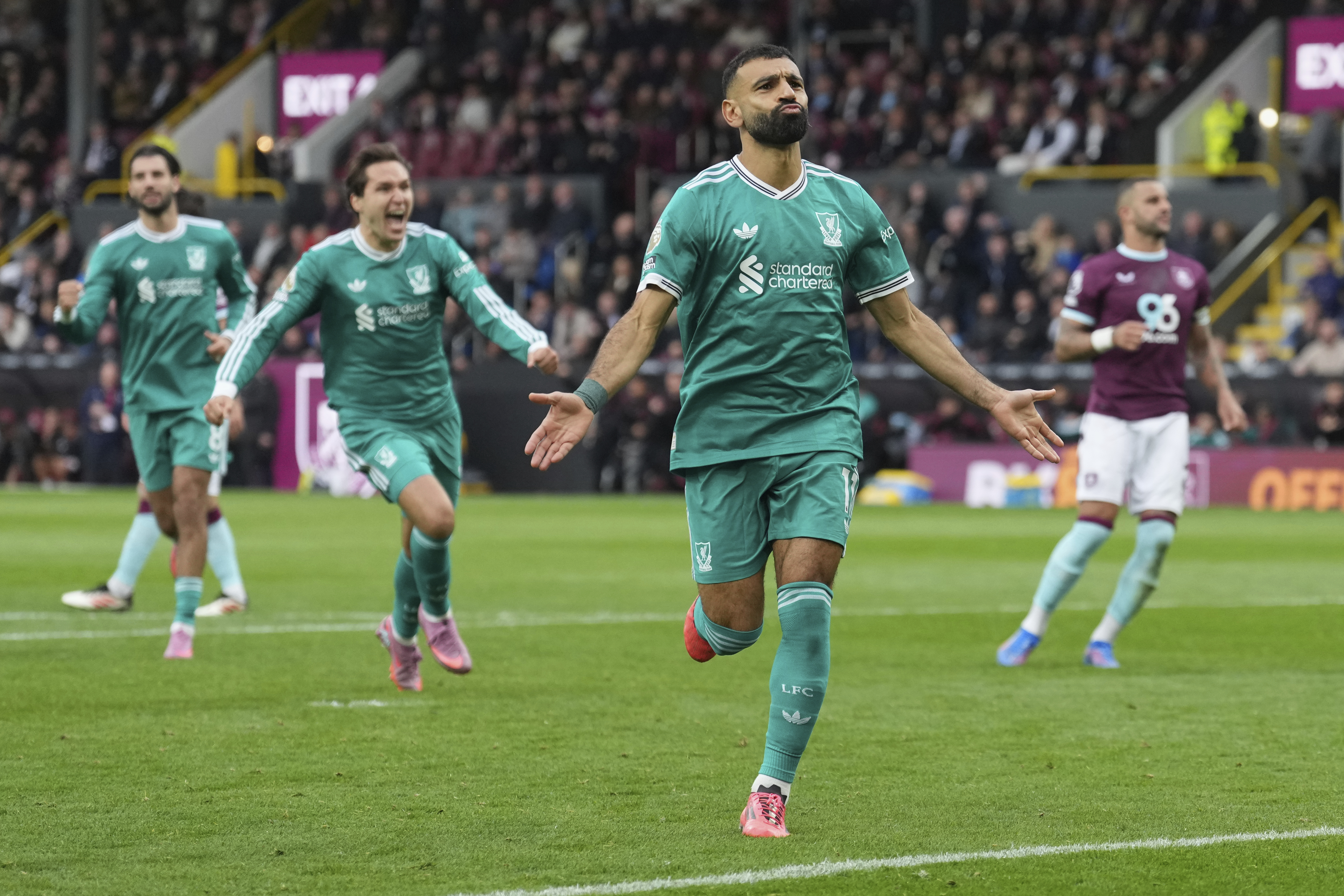 Liverpool's Mohamed Salah celebrate after scoring from a penalty kick during the Premier League soccer match between Burnley and Liverpool in Burnley, England, Sunday, Sept. 14, 2025. 