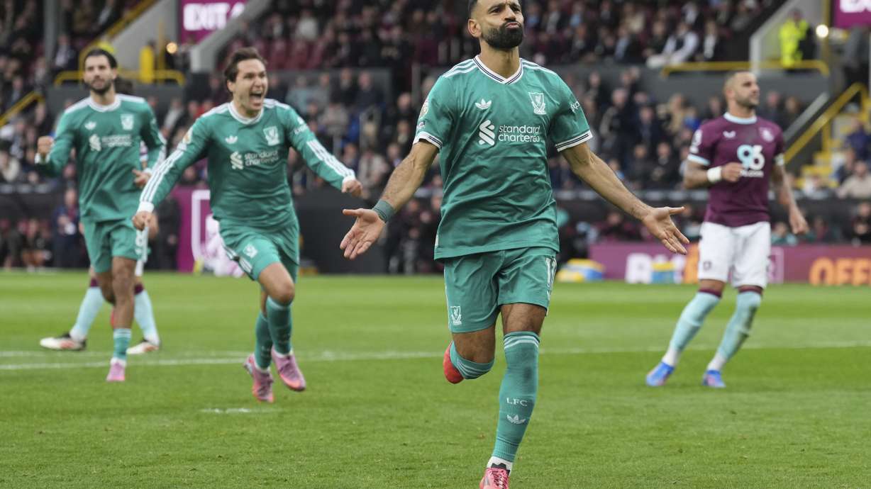 Liverpool's Mohamed Salah celebrate after scoring from a penalty kick during the Premier League soccer match between Burnley and Liverpool in Burnley, England, Sunday, Sept. 14, 2025.