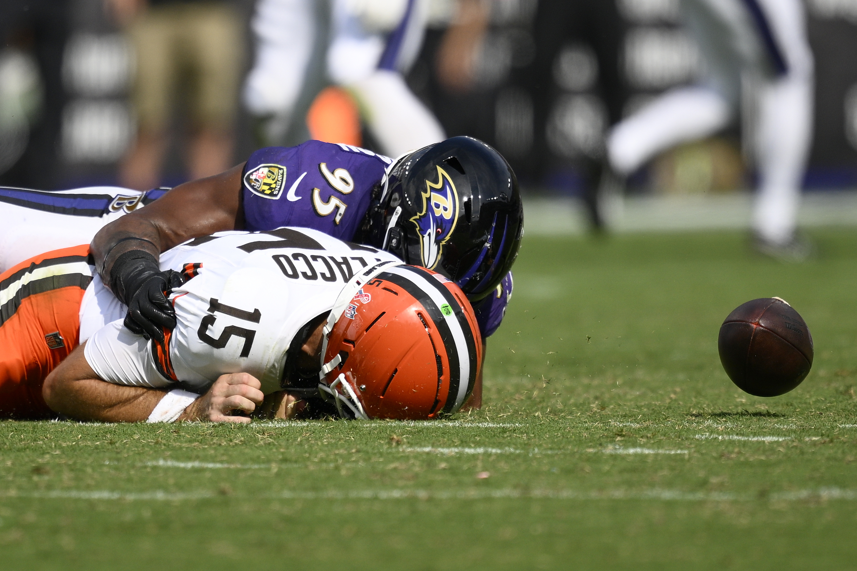 Baltimore Ravens linebacker Tavius Robinson sacks Cleveland Browns quarterback Joe Flacco forcing a fumble during the second half of an NFL football game, Sunday, Sept. 14, 2025, in Baltimore.