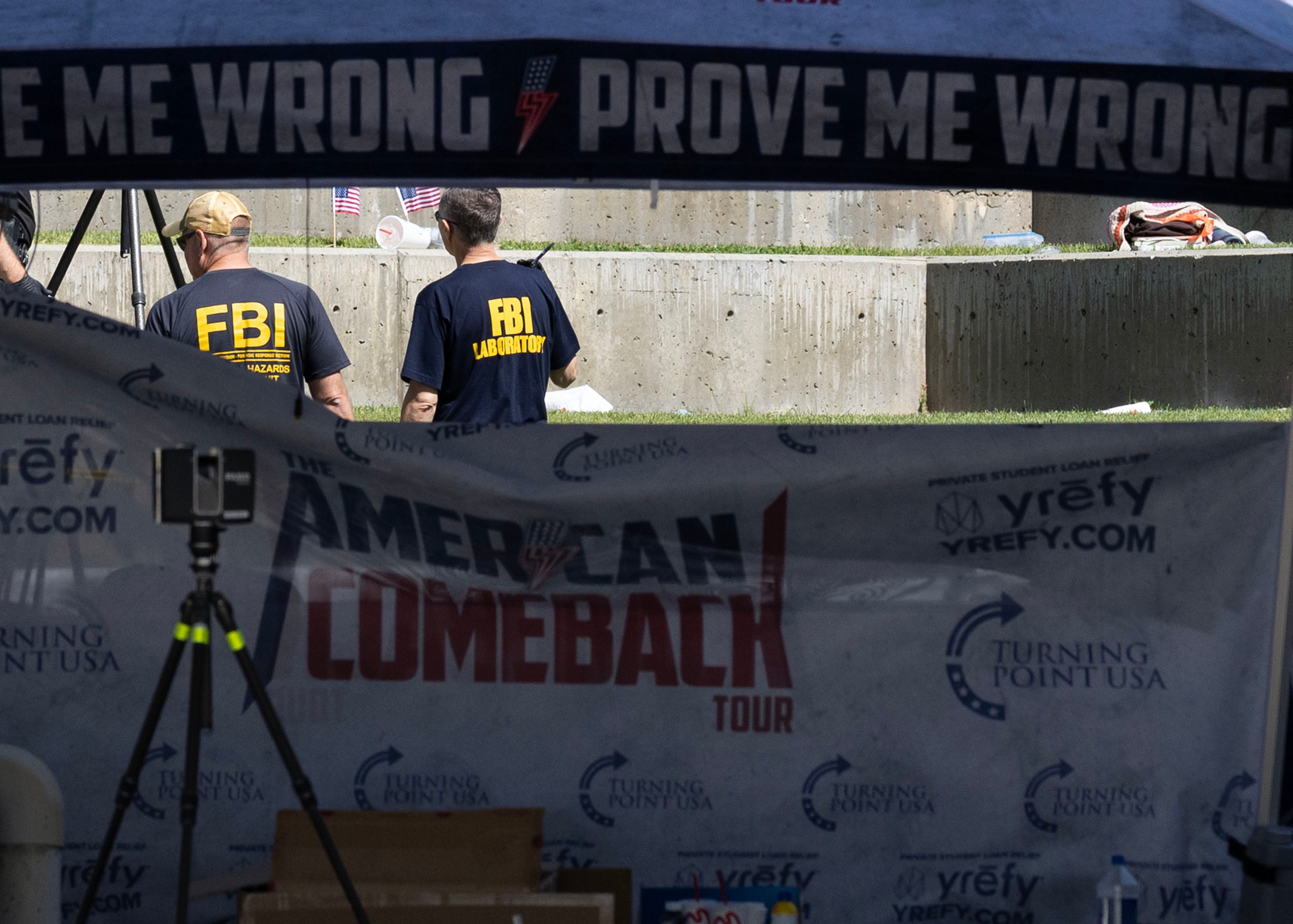 FBI agents investigate the area where Charlie Kirk was shot at Utah Valley University in Orem on Thursday.