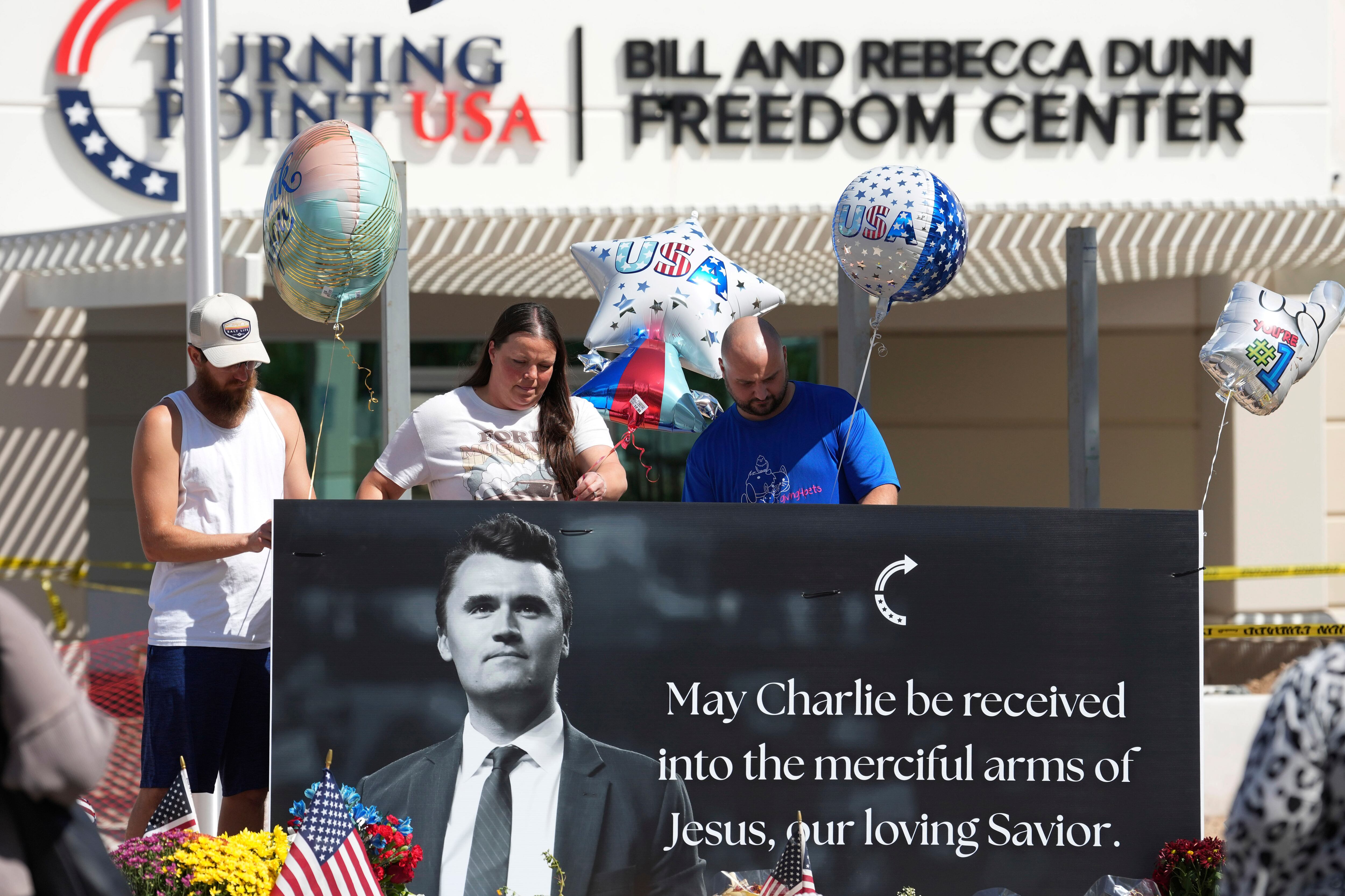 Well-wishers add balloons to a makeshift memorial set up at Turning Point USA headquarters after the shooting death at a Utah college on Wednesday of Charlie Kirk, the 31-year-old founder and CEO of the organization, Thursday in Phoenix.