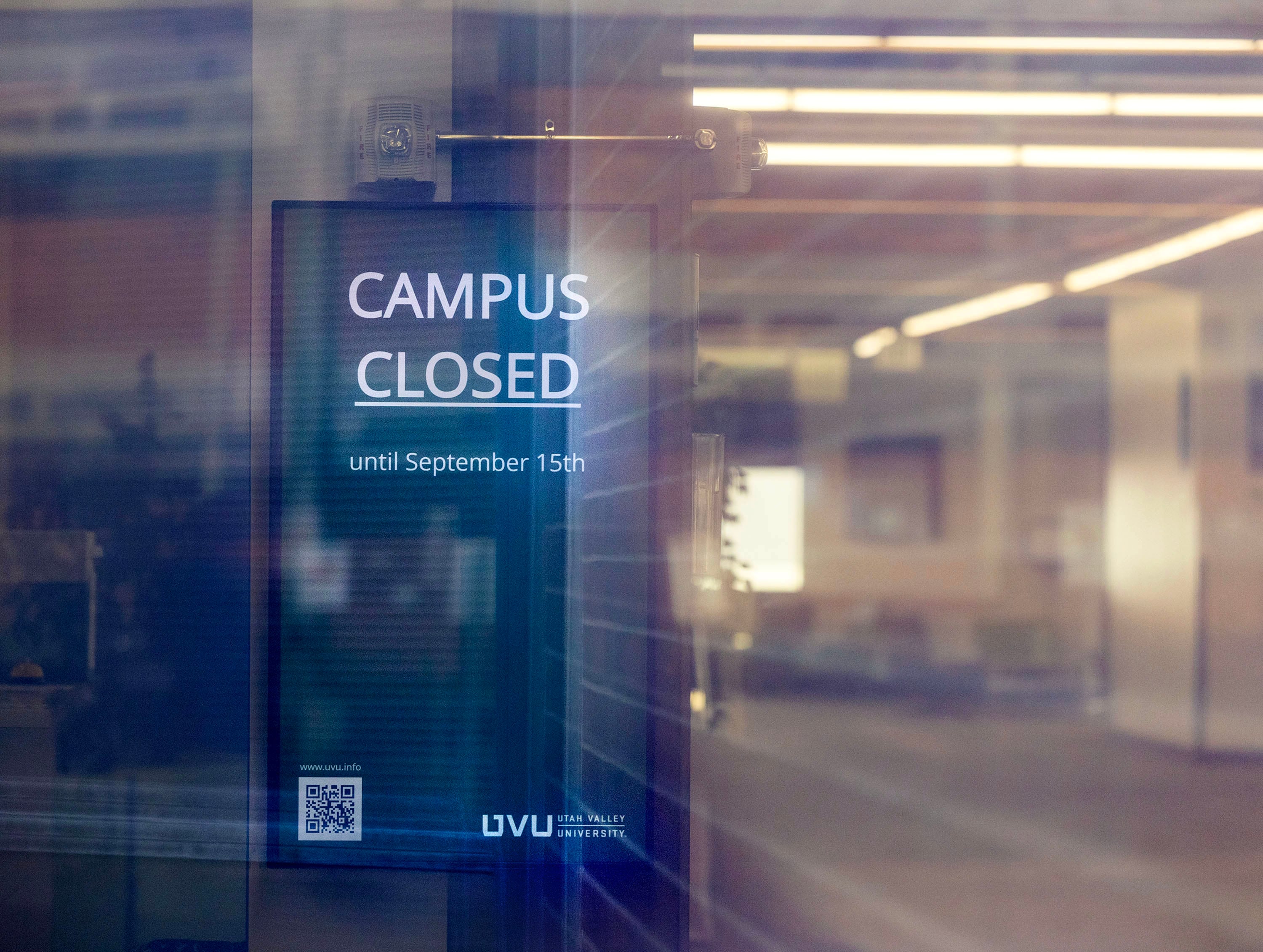 A sign informs students that campus is closed following the shooting of Charlie Kirk at Utah Valley University in Orem on Friday.