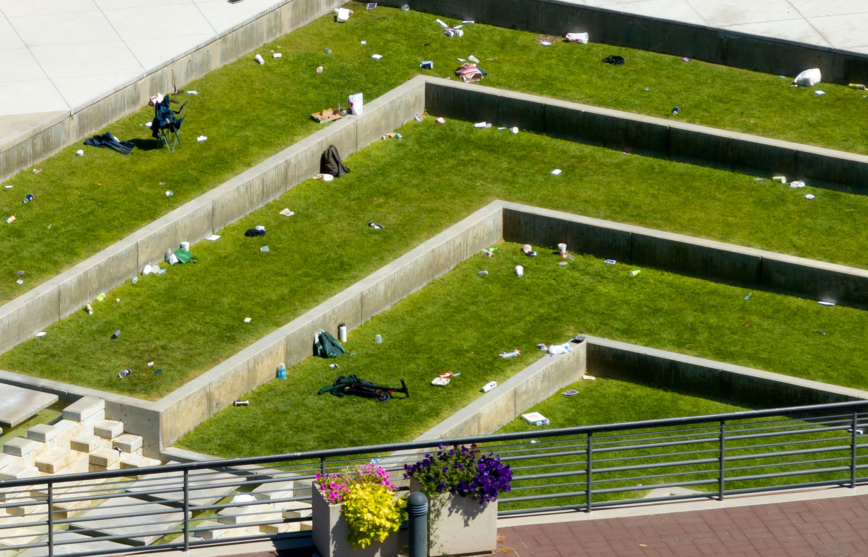People’s belongings remain at the scene following the shooting of conservative activist and Turning Point USA founder Charlie Kirk at Utah Valley University in Orem on Wednesday.