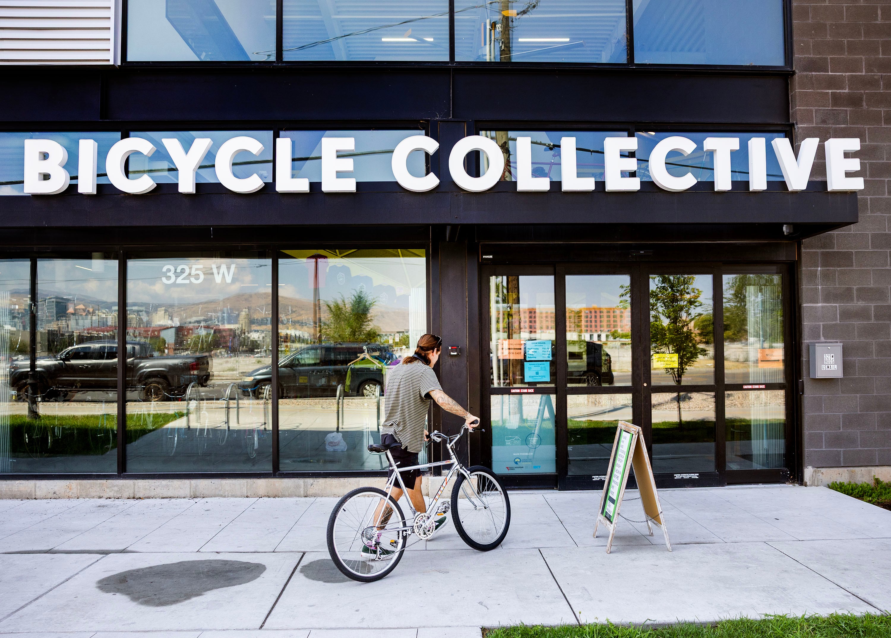 A patron returns a bicycle after taking it for a test drive at the Bicycle Collective in Salt Lake City on Aug. 28.