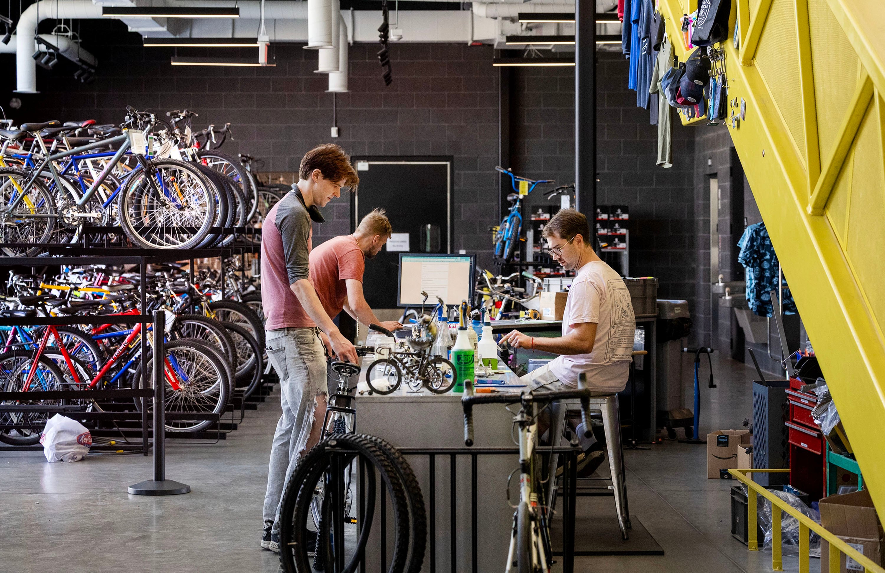 Xander Knecht purchases a refurbished bicycle at the Bicycle Collective in Salt Lake City on Aug. 28.