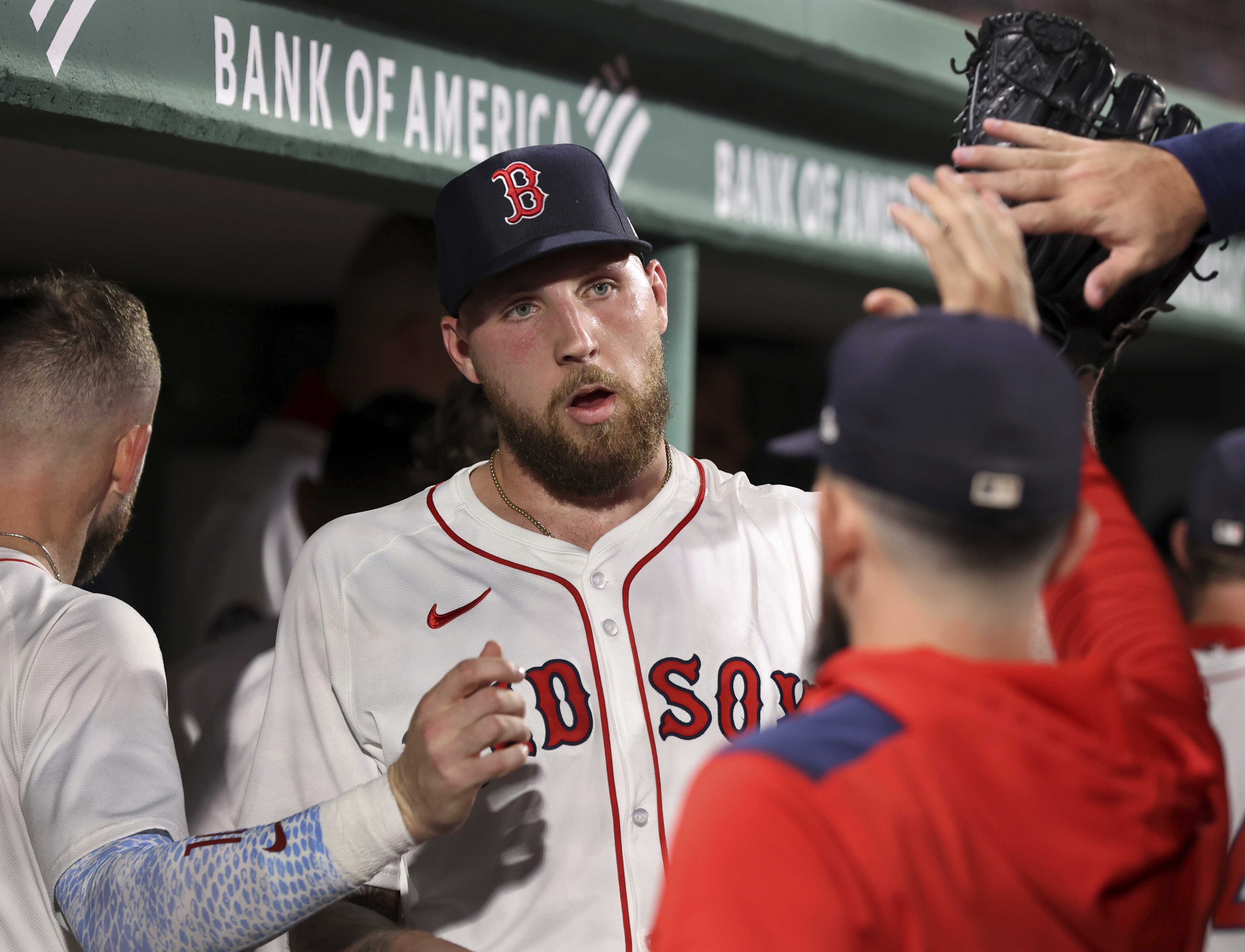 Boston Red Sox pitcher Garrett Crochet is congratulated in the dugout after the seventh inning of a baseball game against the New York Yankees, Sunday, Sept. 14, 2025, in Boston. 