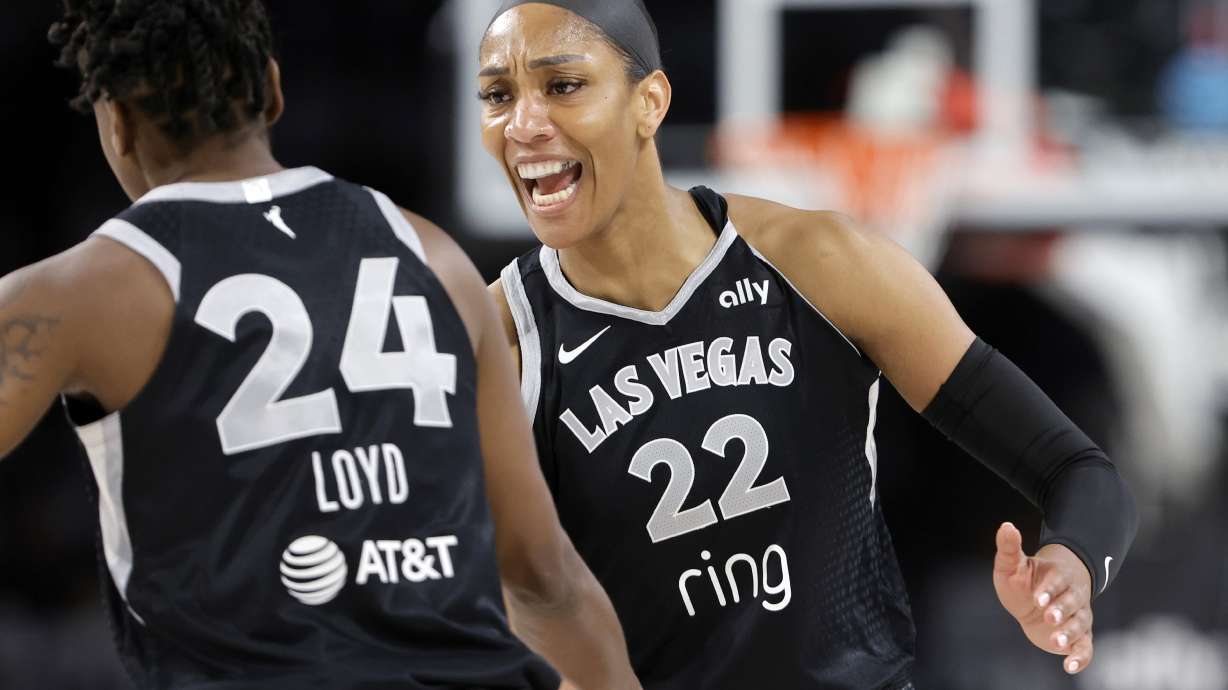 Las Vegas Aces center A'ja Wilson (22) congratulates guard Jewell Loyd (24) after Loyd scored a 3-point basket during the first half of Game 1 against the Seattle Storm in the first round of the WNBA basketball playoffs Sunday, Sept. 14, 2025, in Las Vegas.