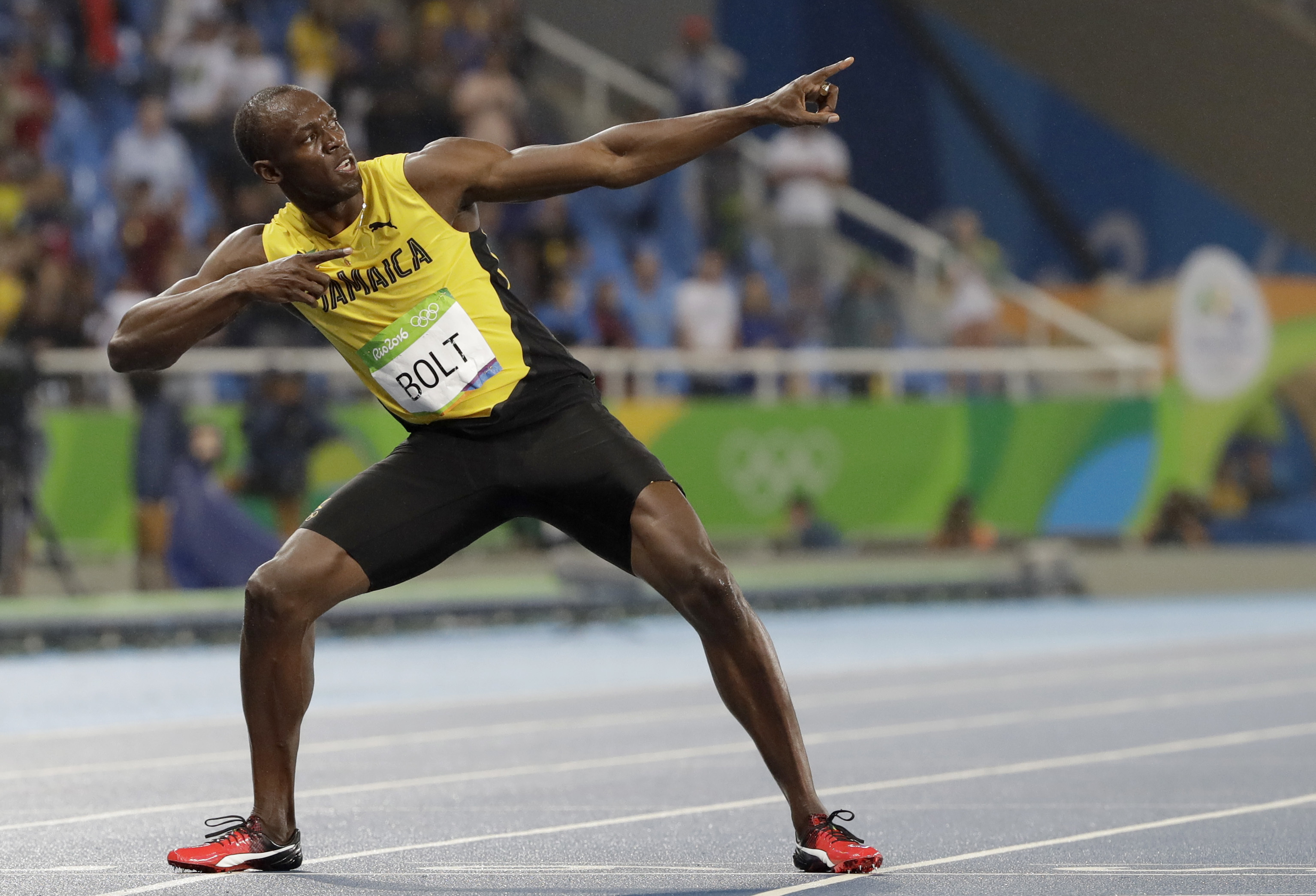 FILE - Usain Bolt from Jamaica celebrates winning the gold medal in the men's 200-meter final during the athletics competitions of the 2016 Summer Olympics at the Olympic stadium in Rio de Janeiro, Brazil, Thursday, Aug. 18, 2016. 