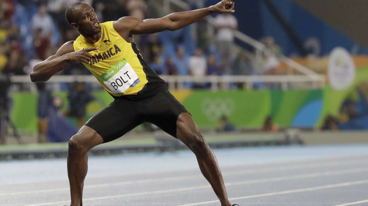FILE - Usain Bolt from Jamaica celebrates winning the gold medal in the men's 200-meter final during the athletics competitions of the 2016 Summer Olympics at the Olympic stadium in Rio de Janeiro, Brazil, Thursday, Aug. 18, 2016.