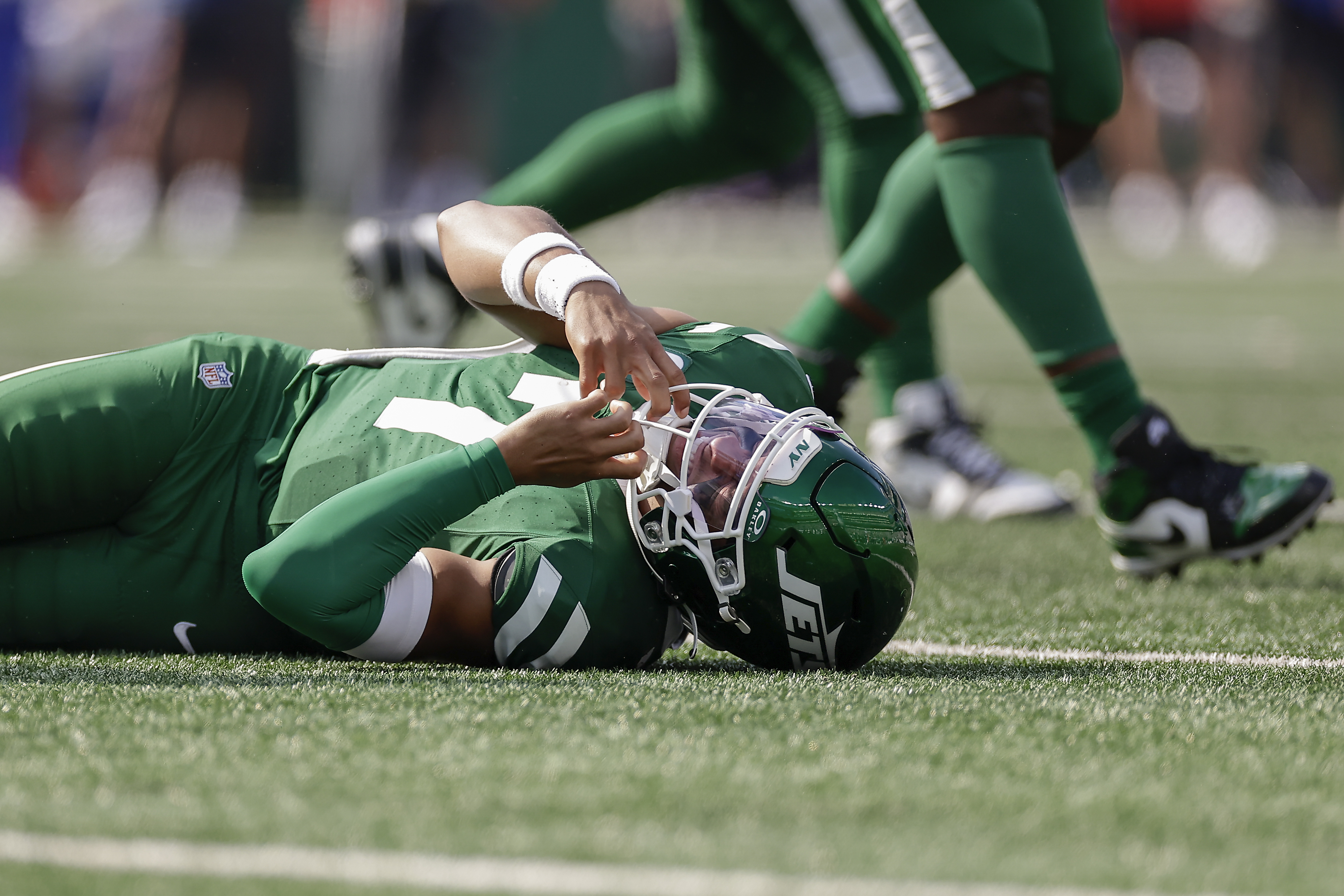 New York Jets quarterback Justin Fields (7) reacts after being sacked by the Buffalo Bills during the fourth quarter of an NFL football game, Sunday, Sept. 14, 2025, in East Rutherford, N.J. 