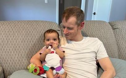 Justin Tibbs, of St. George, holds his daughter, Elie Tibbs. Elie, 9 months old, received a liver transplant through a paired exchange. Justin Tibbs was a donor in the exchange.