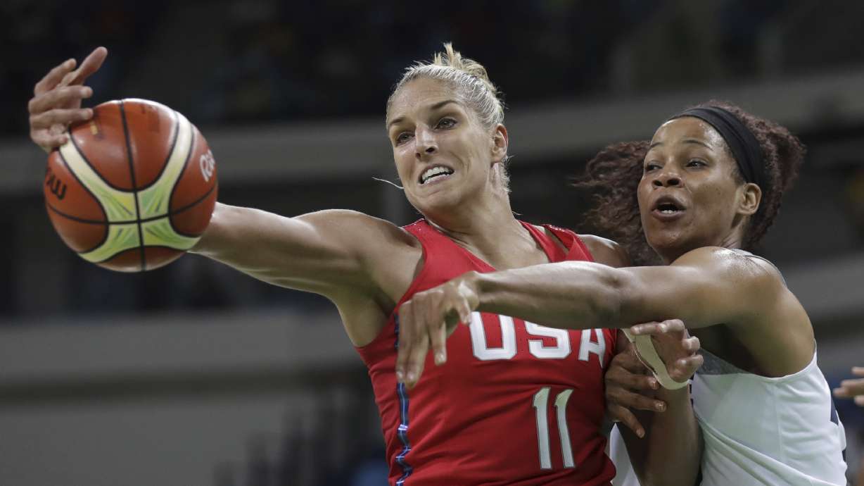 File - This Aug. 18, 2016, file photo shows United States' Elena Delle Donne (11) and France's Marielle Amant, right, reaching out for the ball during a women's semifinal round basketball game at the 2016 Summer Olympics in Rio de Janeiro, Brazil.