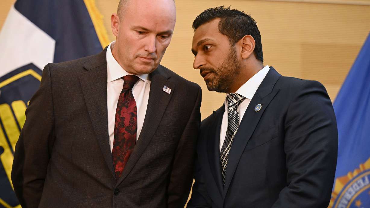 Utah Gov. Spencer Cox and FBI Director Kash Patel speak to each other during a press conference on the campus of UVU, where it was announced that the suspect in Charlie Kirk’s murder had been arrested in Orem on Friday.