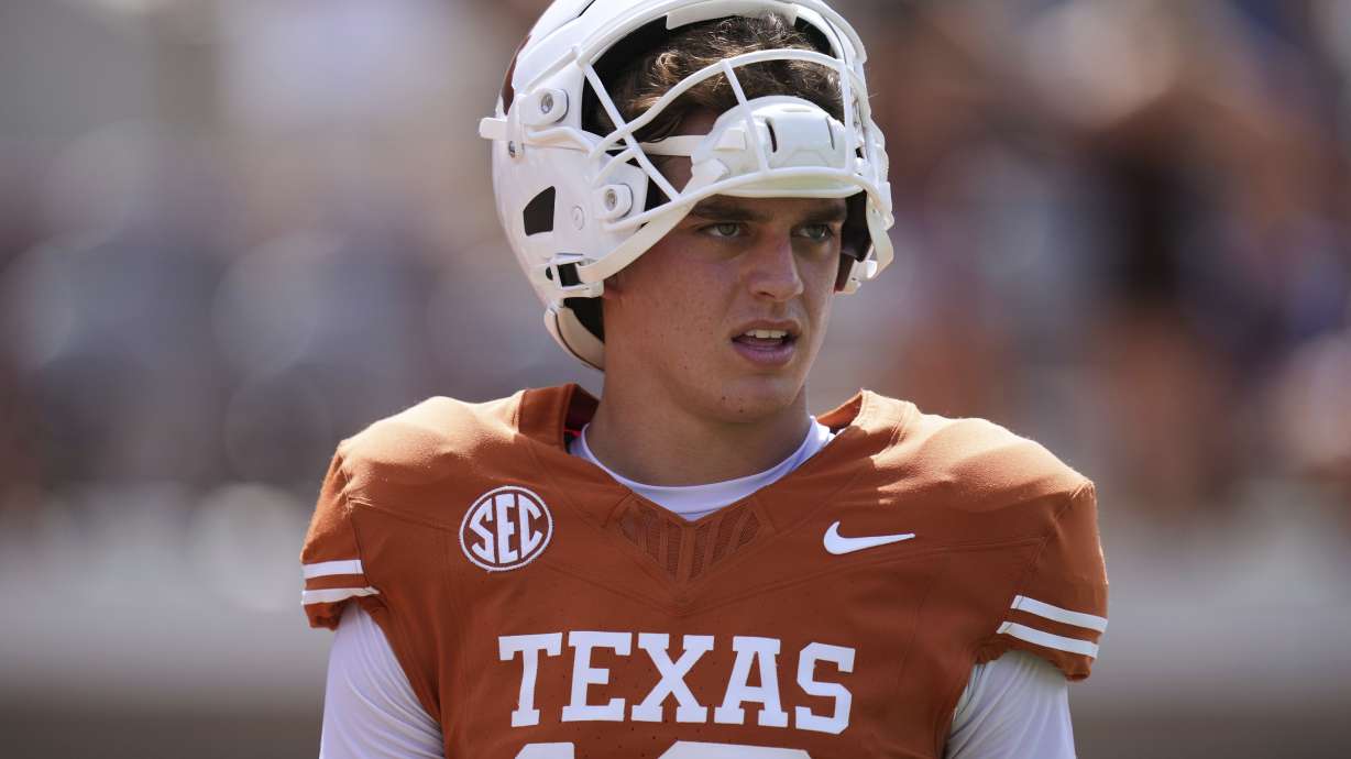 Texas quarterback Arch Manning (16) warms up before an NCAA college football game against UTEP in Austin, Texas, Saturday, Sept. 13, 2025.