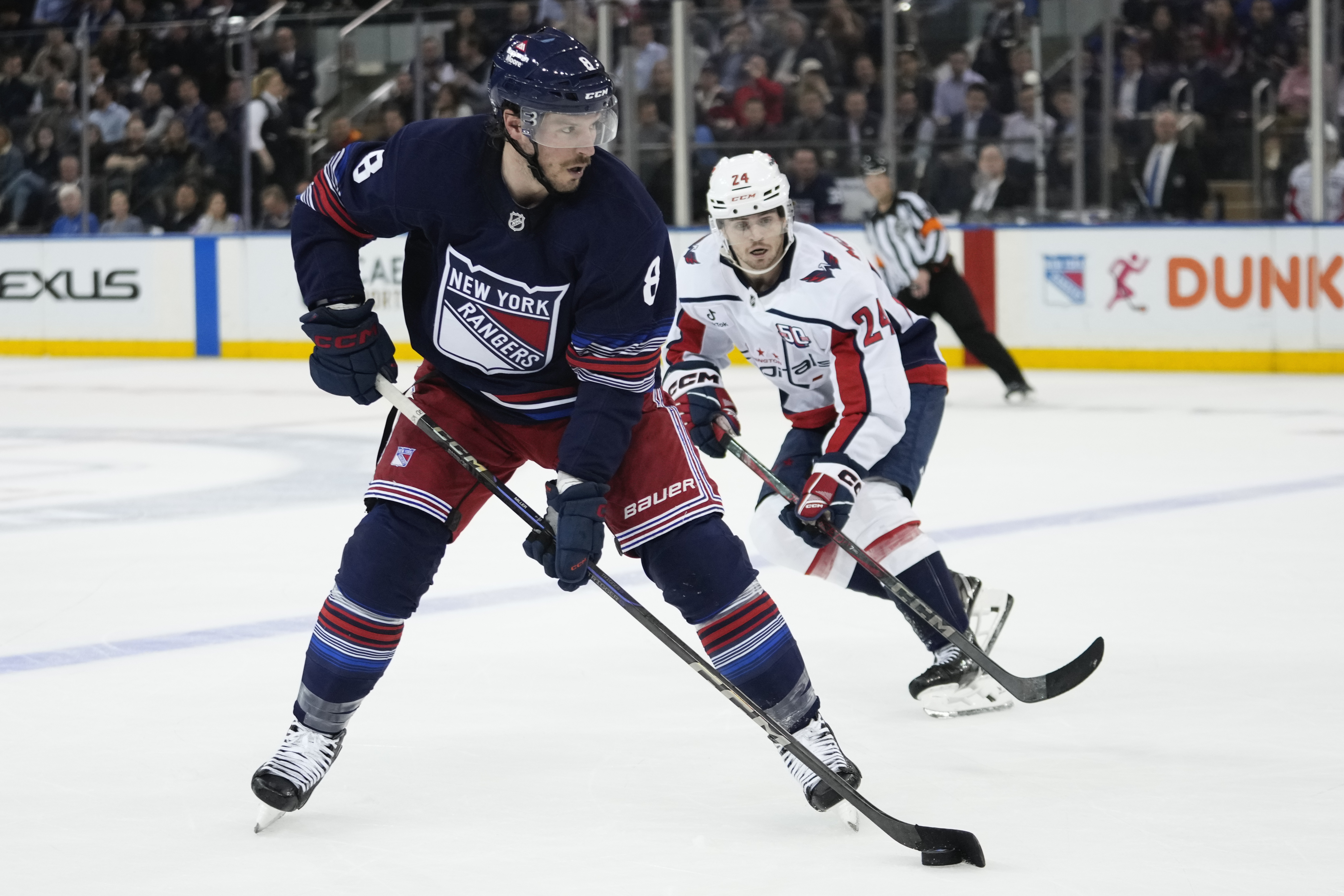 FILE - New York Rangers' J.T. Miller (8) drives past Washington Capitals' Connor McMichael (24) during the second period of an NHL hockey game Wednesday, March 5, 2025, in New York. 