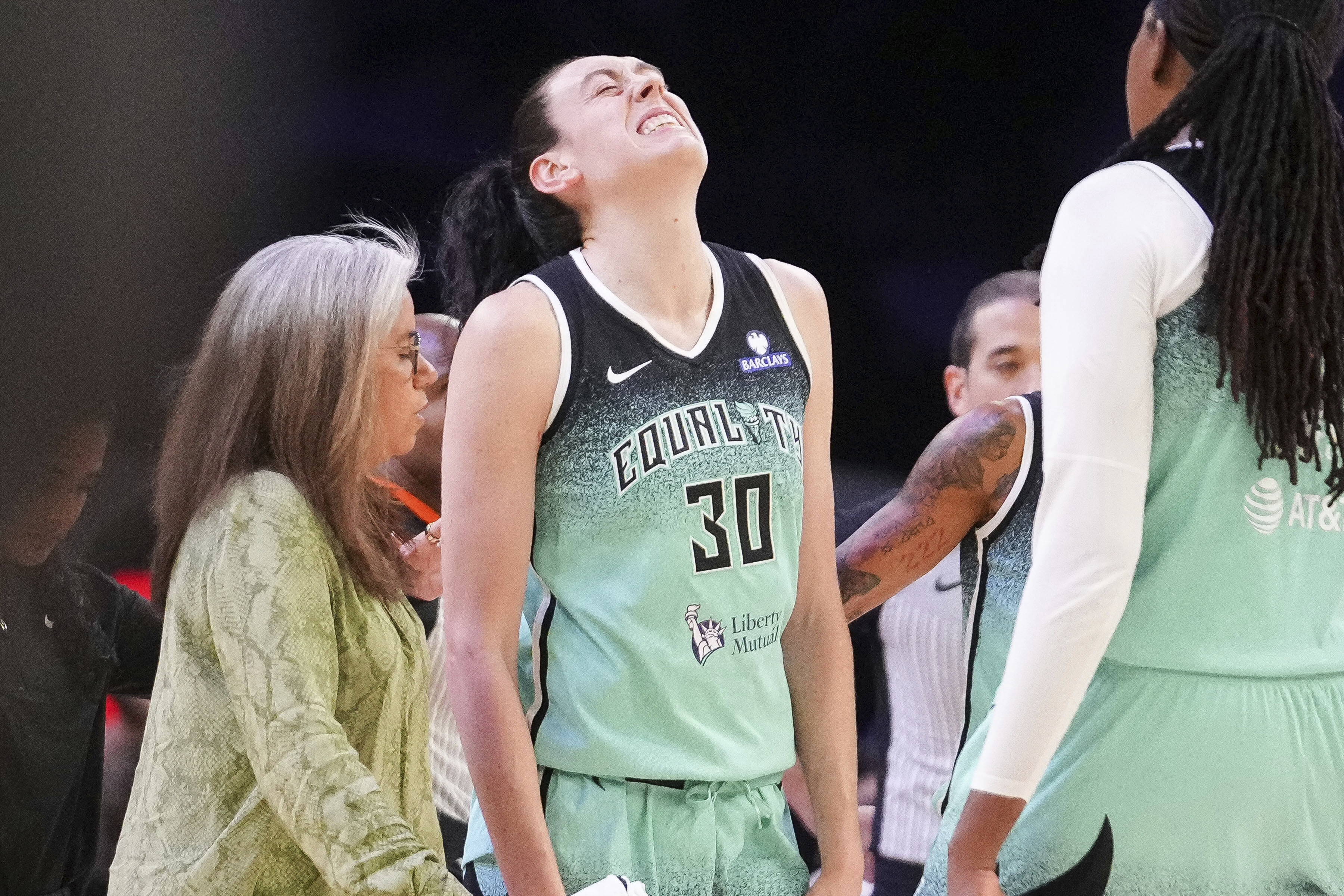 New York Liberty forward Breanna Stewart (30) grimaces after getting fouled by the Phoenix Mercury during the second half of Game 1 during the first round of the WNBA basketball playoffs Sunday, Sept. 14, 2025, in Phoenix. 