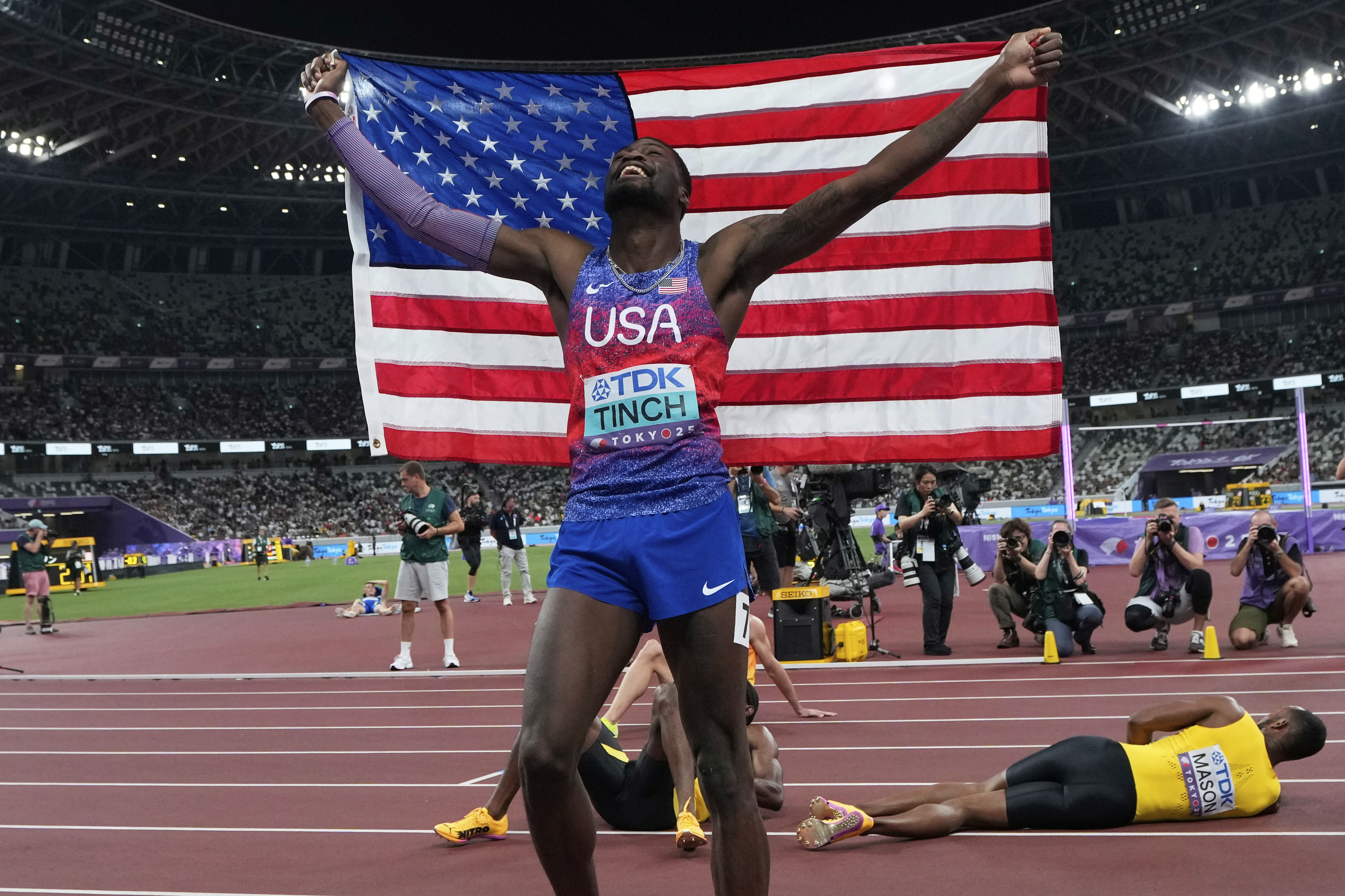 United States' Cordell Tinch celebrates after winning gold medal in men's 110 meters hurdles final at the World Athletics Championships in Tokyo, Tuesday, Sept. 16, 2025. 