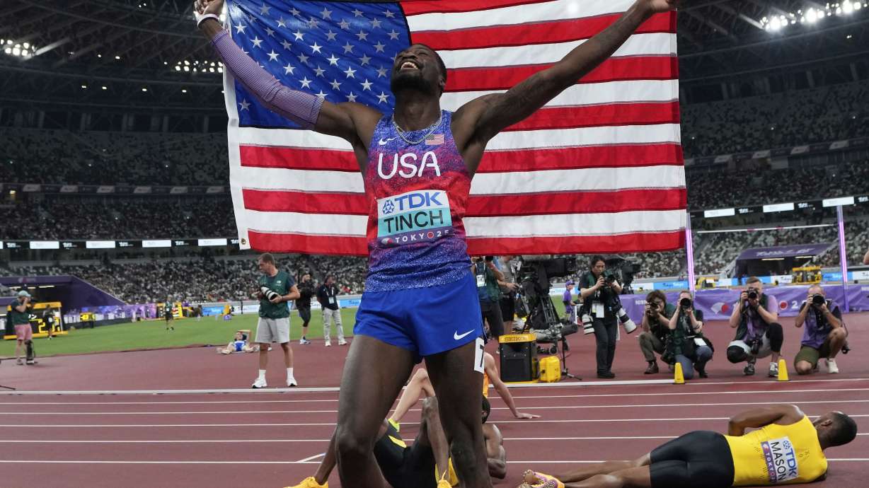 United States' Cordell Tinch celebrates after winning gold medal in men's 110 meters hurdles final at the World Athletics Championships in Tokyo, Tuesday, Sept. 16, 2025.
