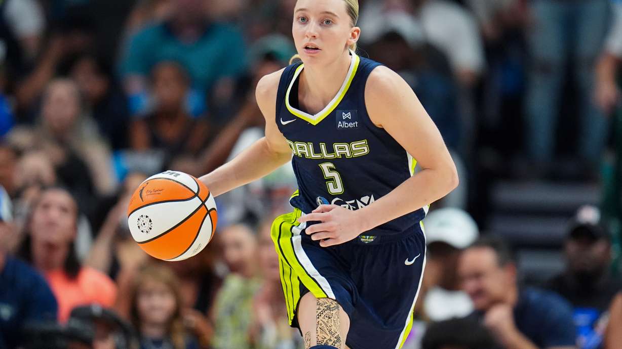 FILE - Dallas Wings guard Paige Bueckers dribbles up court against the Indiana Fever during the second half of a WNBA basketball game Friday, Aug. 1, 2025, in Dallas.