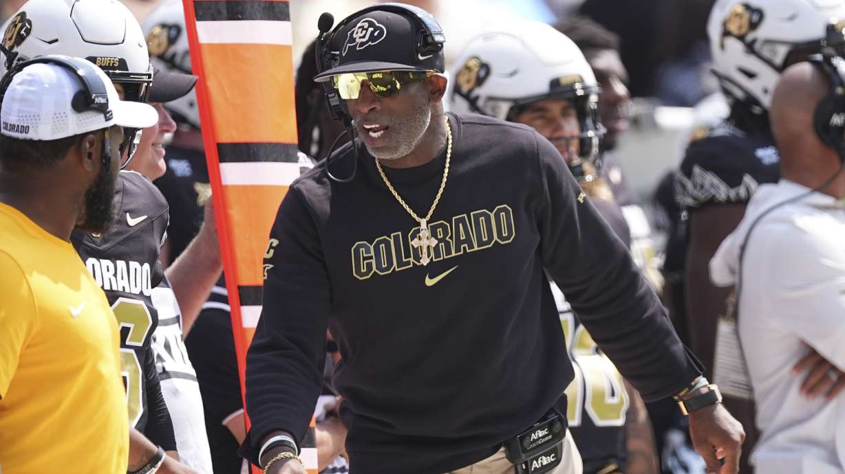 Colorado head coach Deion Sanders directs players in the first half of an NCAA college football game against Delaware Saturday, Sept. 6, 2025, in Boulder, Colo.