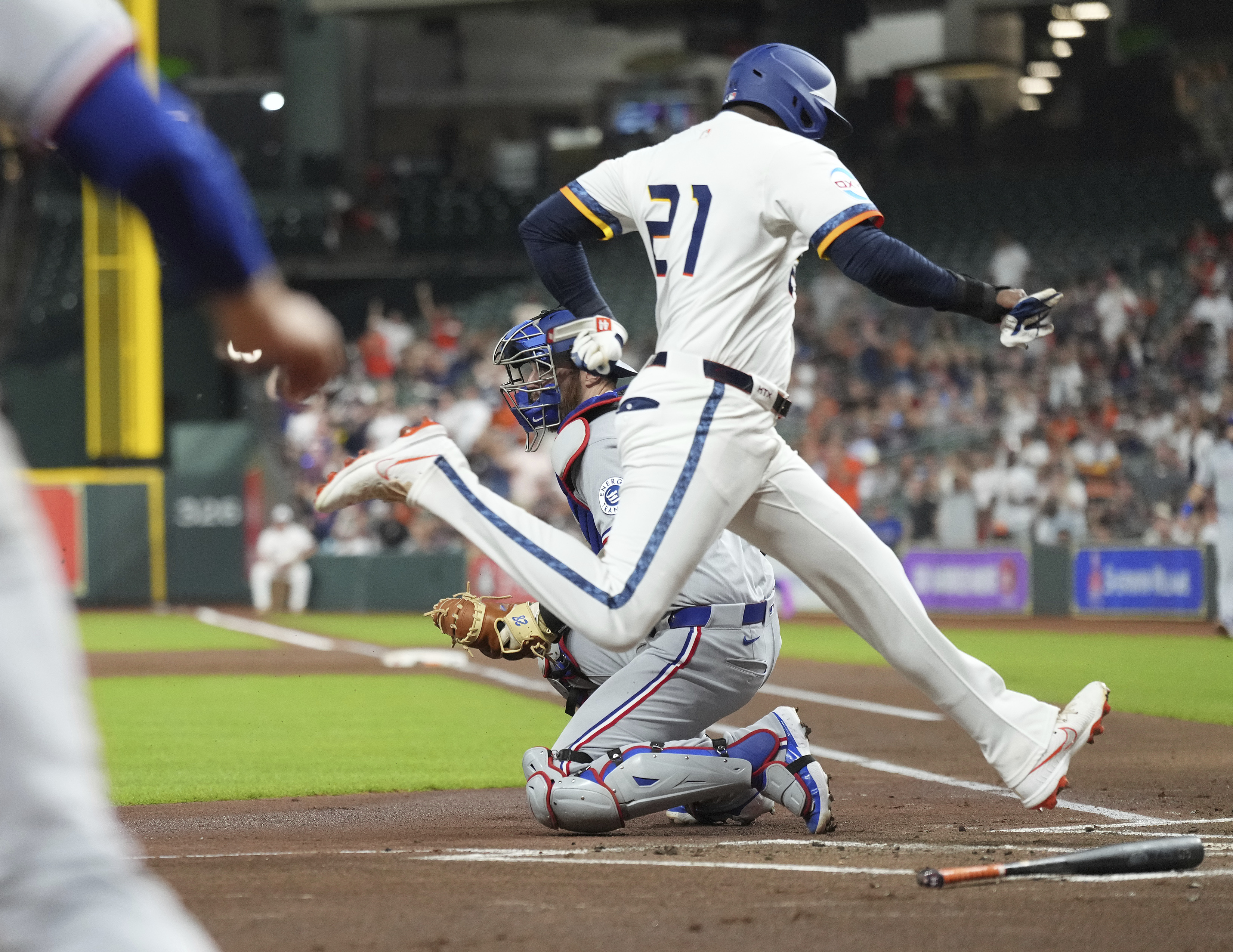 Houston Astros' Yordan Alvarez, front right, scores on an RBI single hit by Carlos Correa against the Texas Rangers during the first inning of a baseball game Monday, Sept. 15, 2025, in Houston. 