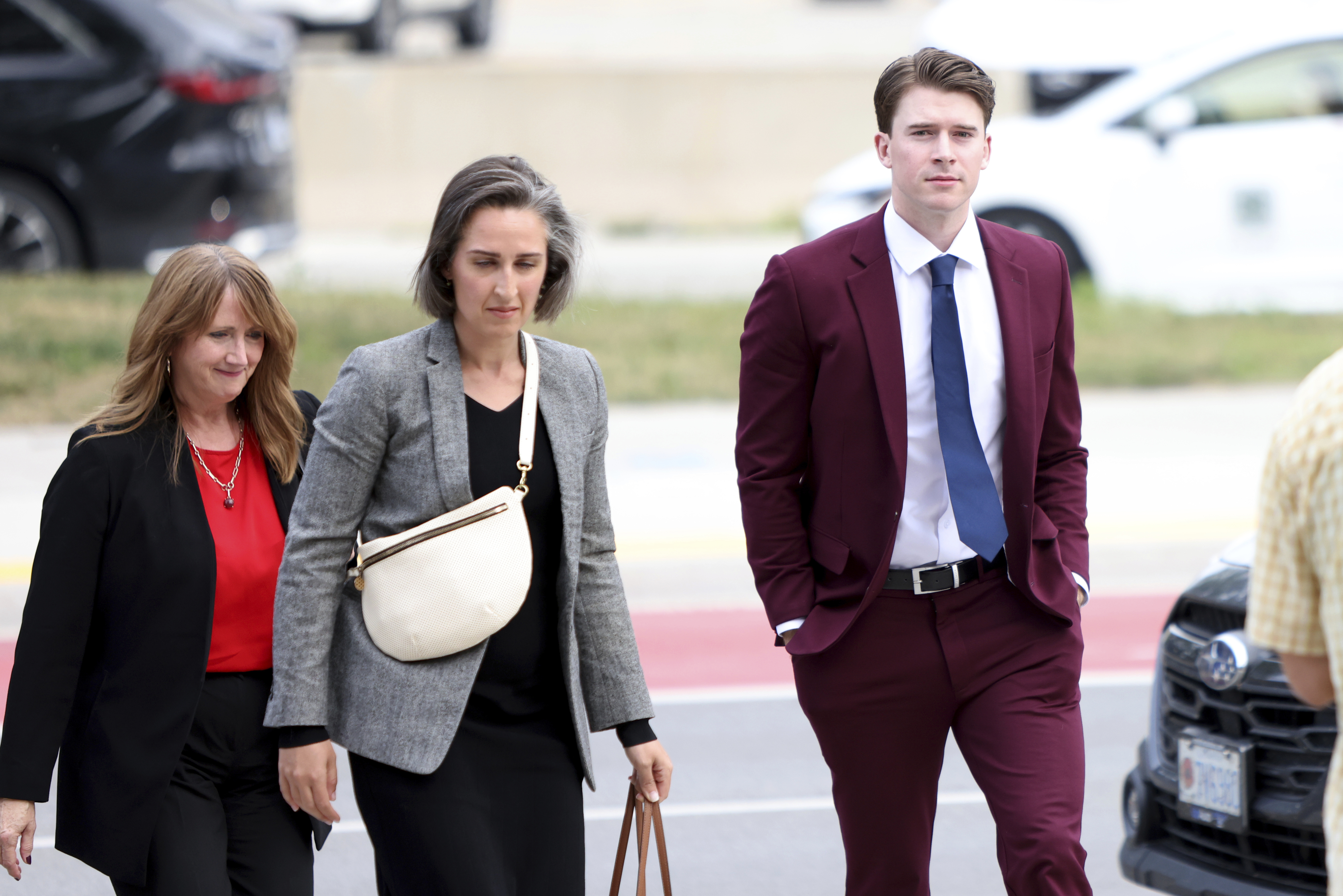FILE - Hockey player Carter Hart, right, arrives at the London Courthouse in London, Ontario, Thursday, July 24, 2025. 