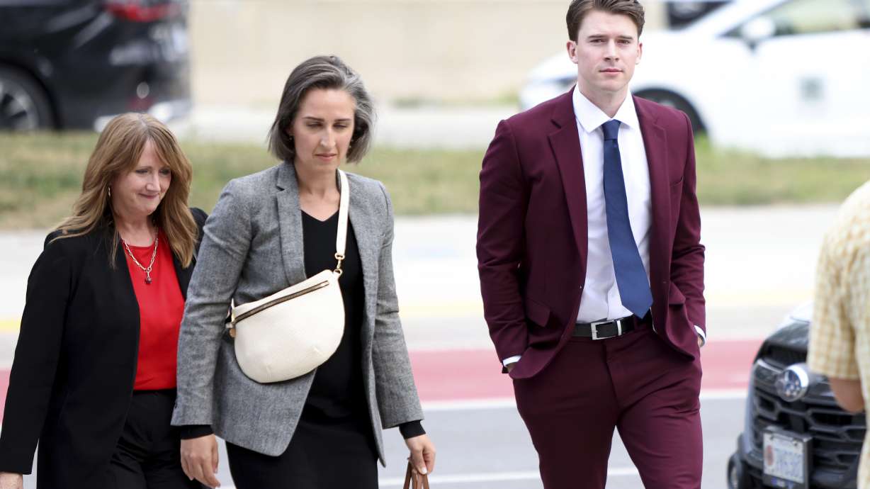 FILE - Hockey player Carter Hart, right, arrives at the London Courthouse in London, Ontario, Thursday, July 24, 2025.