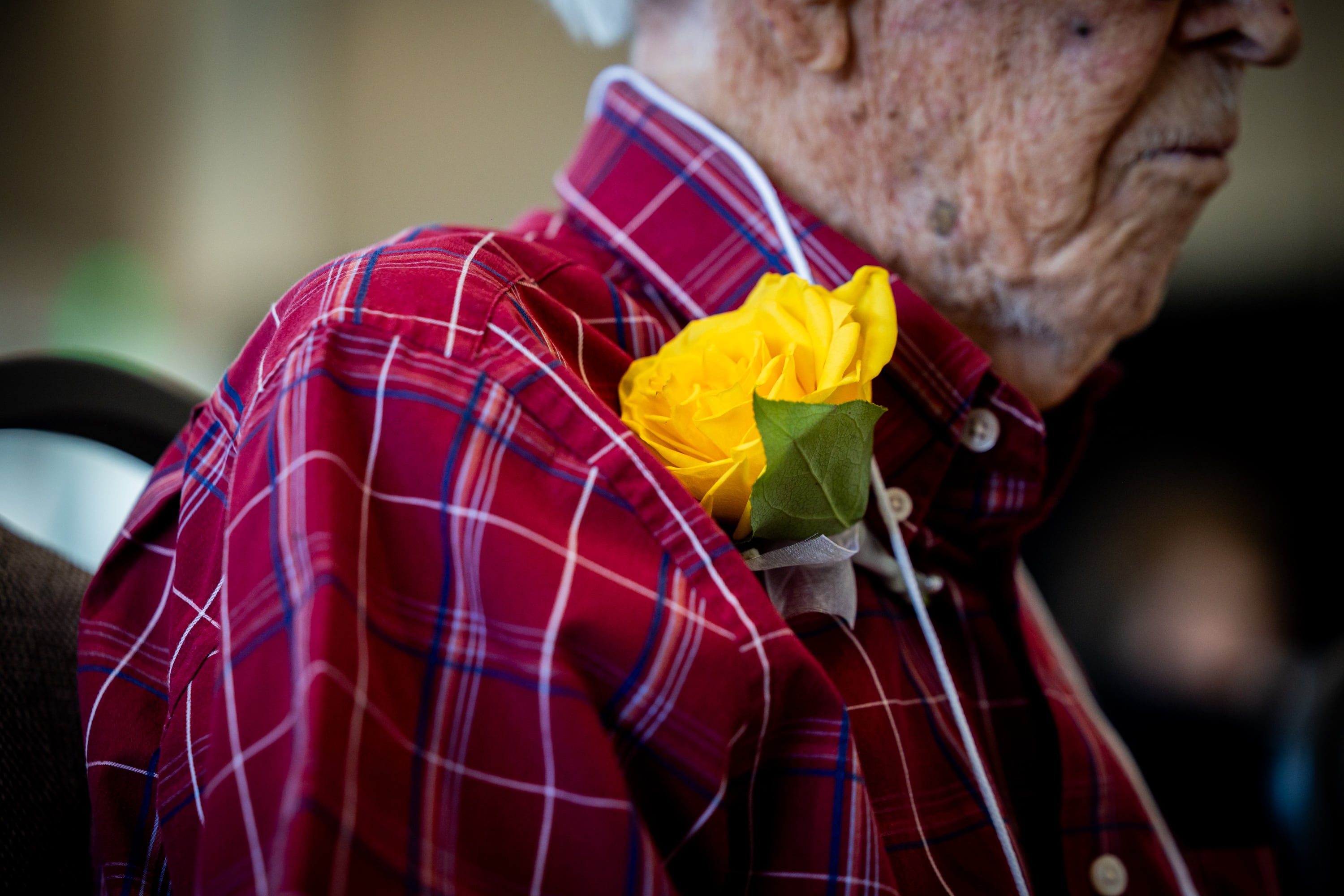 Wayne Clayson, 104, sports a flower at the 37th annual Utah’s Club Centenarians celebration in West Jordan on Tuesday. Clayson was the oldest man in attendance.