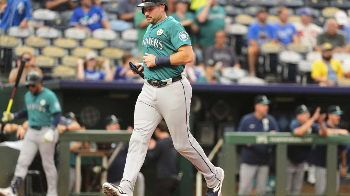 Seattle Mariners' Cal Raleigh runs home to score on a double by Julio Rodriguez during the first inning of a baseball game against the Kansas City Royals, Tuesday, Sept. 16, 2025, in Kansas City, Mo.