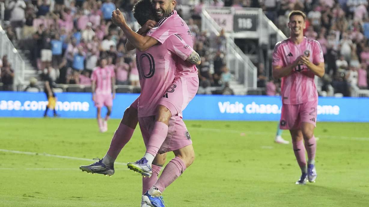 Inter Miami forward Lionel Messi, left, celebrates with defender Jordi Alba, right, after scoring a goal during the first half of an MLS soccer match against Seattle Sounders, Tuesday, Sept. 16, 2025, in Fort Lauderdale, Fla.
