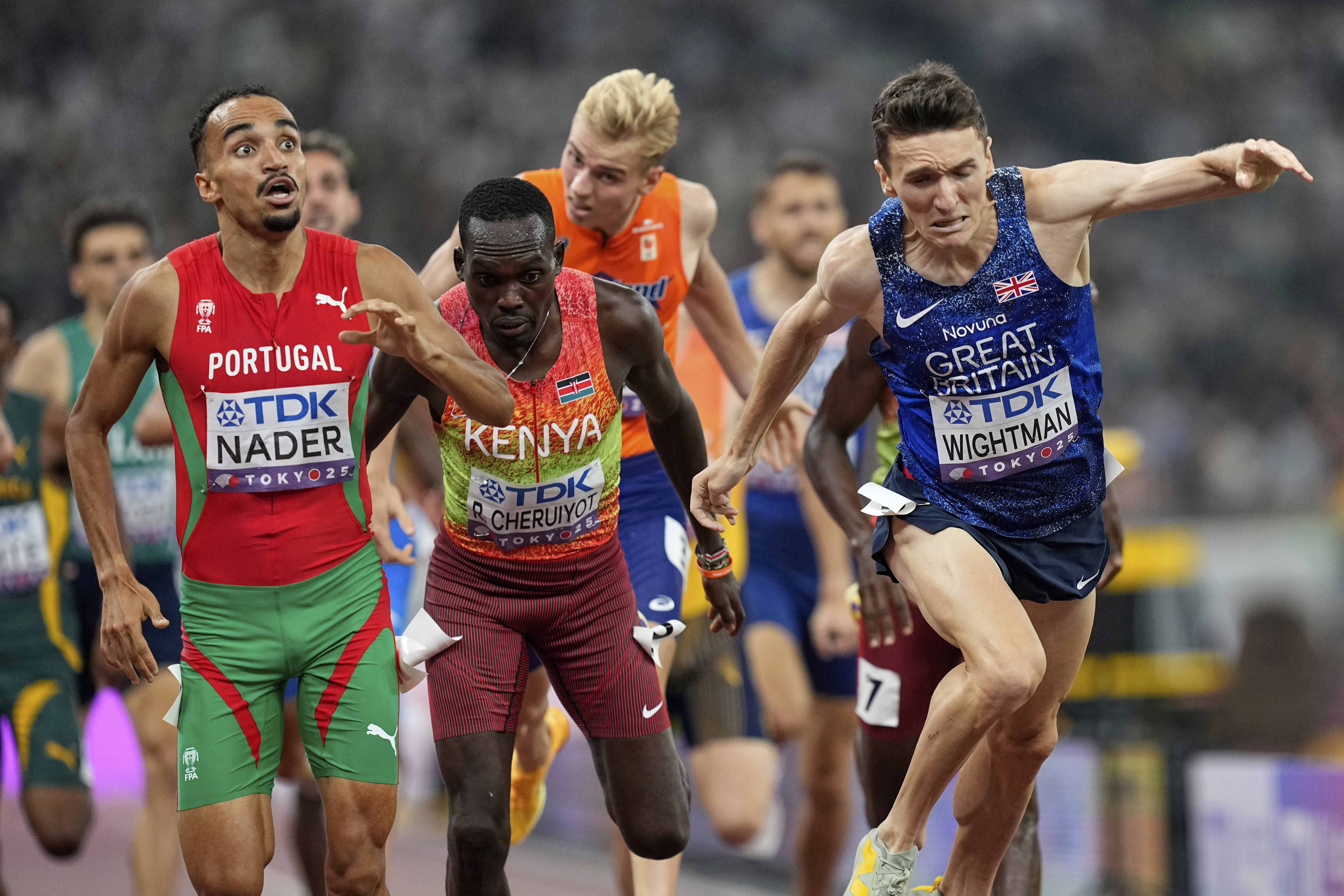 Portugal's Isaac Nader celebrates after winning the gold medal ahead of Britain's Jake Wightman in the men's 1,500 meters final at the World Athletics Championships in Tokyo, Wednesday, Sept. 17, 2025. 