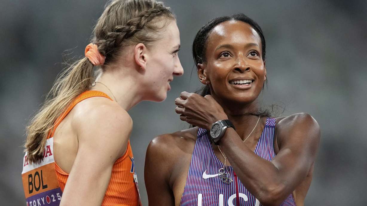 Netherlands' Femke Bol chats to United States' Dalilah Muhammad after they finished a women's 400 meters hurdles semifinal at the World Athletics Championships in Tokyo, Wednesday, Sept. 17, 2025.