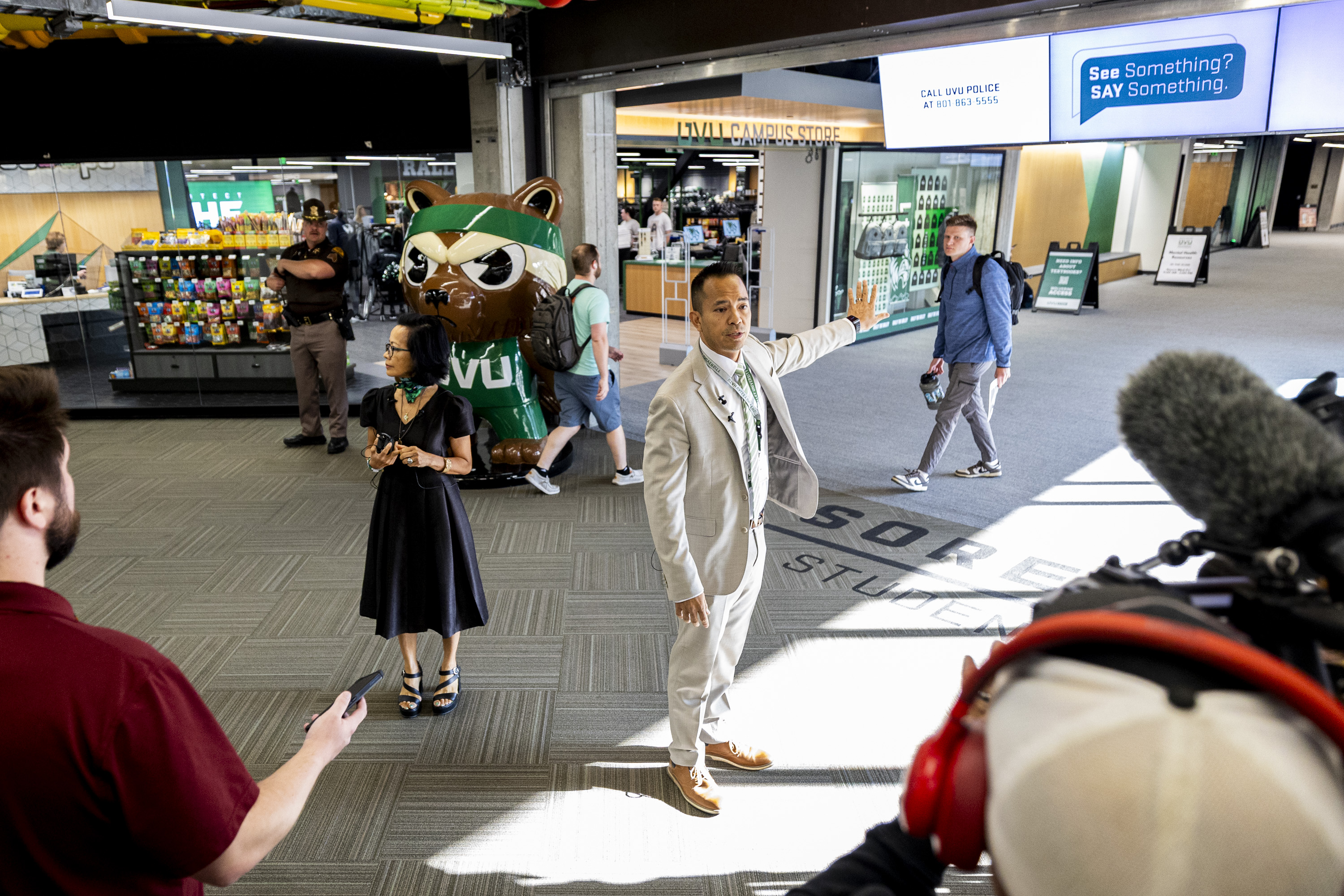 Kyle Reyes, vice president of institutional advancement at Utah Valley University, speaks alongside UVU President Astrid Tuminez as they lead a campus walkthrough for members of the media in Orem on Wednesday.