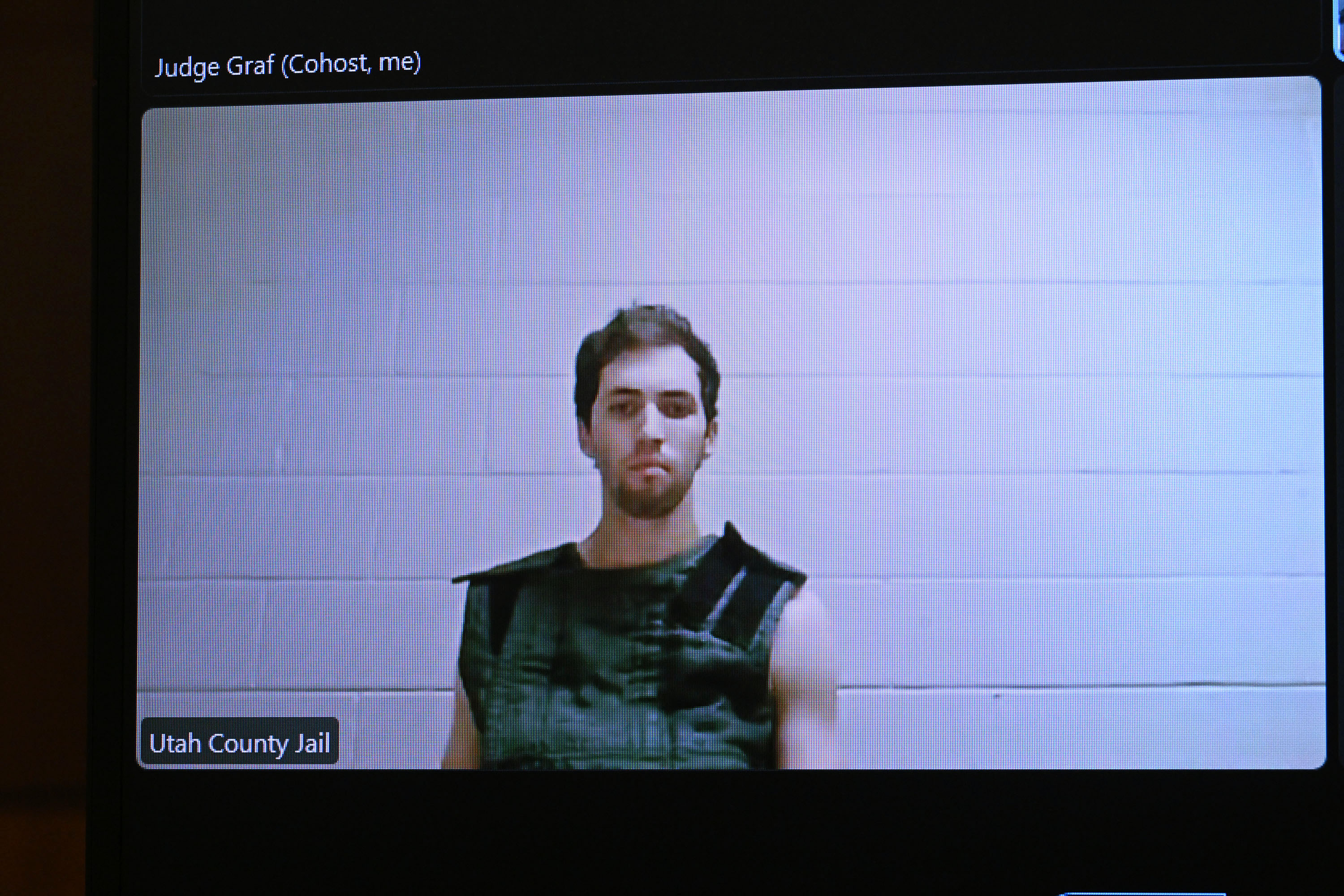 Tyler Robinson, 22, the suspect in the shooting death of Charlie Kirk, appears by camera before 4th District Court Judge Tony Graf on Tuesday. Washington County's sheriff on Wednesday described how Robinson turned himself in.