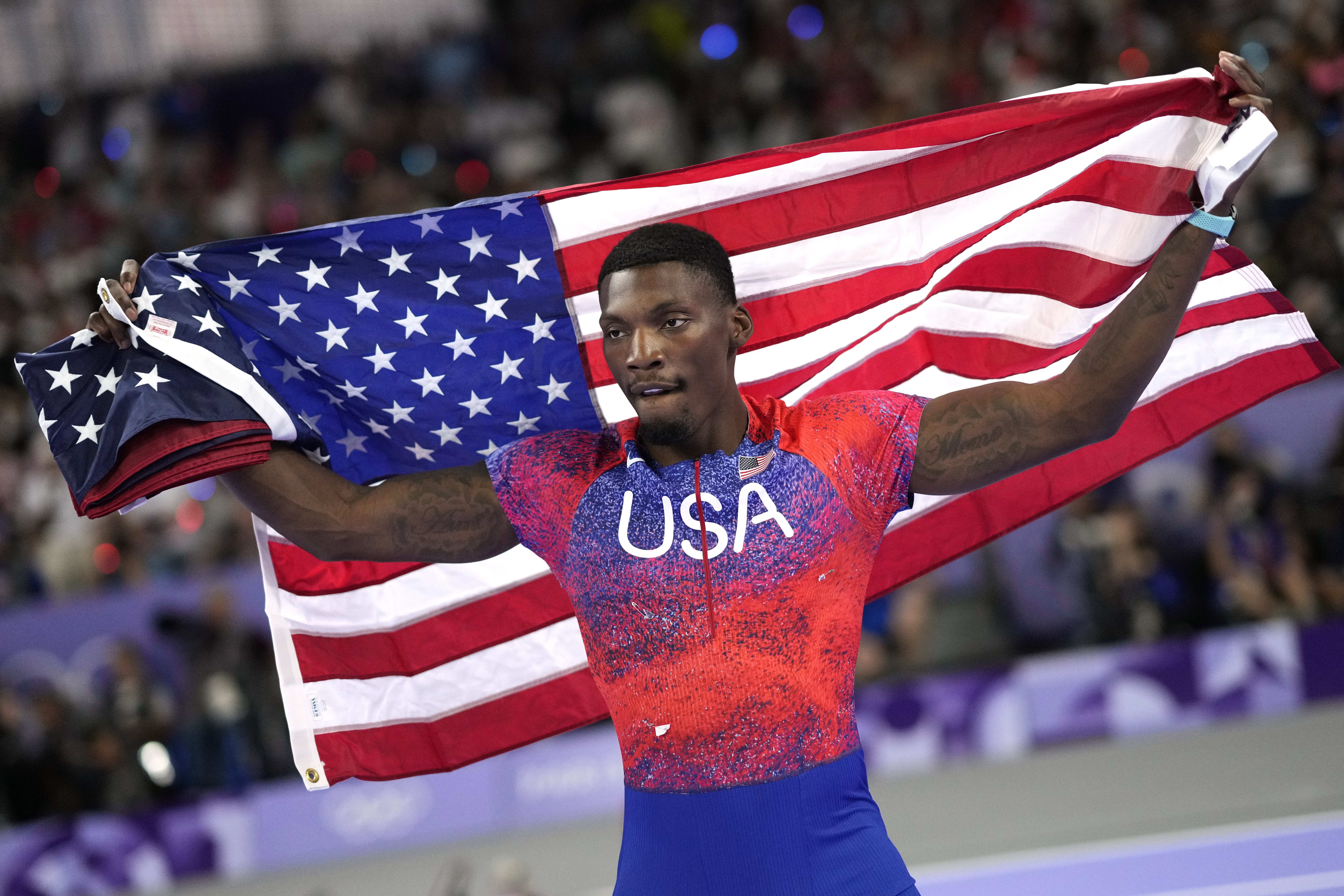 FILE - Fred Kerley, of the United States, celebrates after his third place finish in the men's 100-meter final at the 2024 Summer Olympics, on Aug. 4, 2024, in Saint-Denis, France. 
