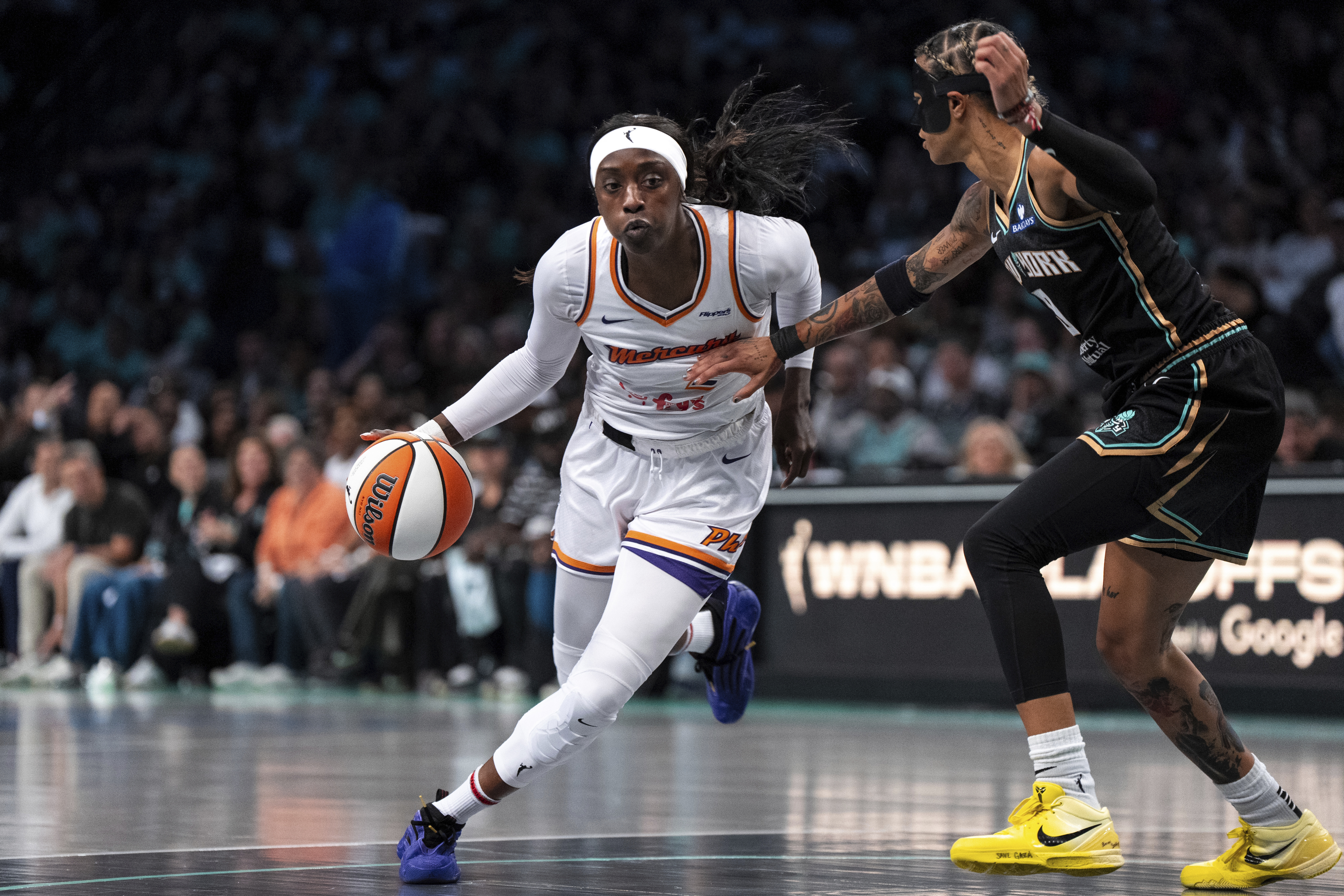 Phoenix Mercury guard Kahleah Copper (2), defended by New York Liberty guard Natasha Cloud (9), heads toward the basket during Game 2 in the first round of the WNBA basketball playoffs, Wednesday, Sept. 17, 2025, in New York.